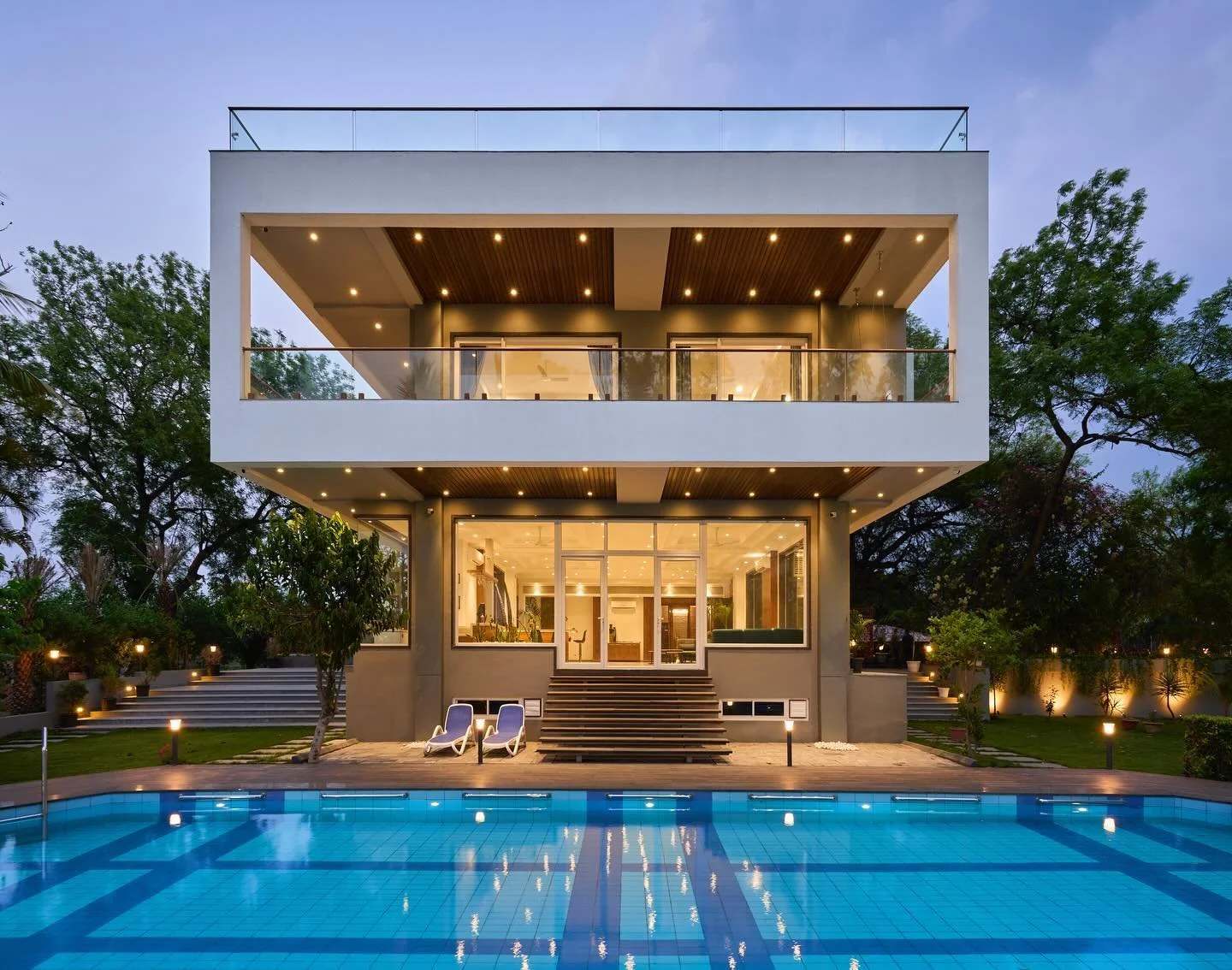 Luxurious farmhouse designed with an elegant, minimalist approach to enhance the surrounding landscape. 
Architectural design and planning, landscape and site development, and interior design by @sunilnagalassociates 

Project Photography by @ashishb