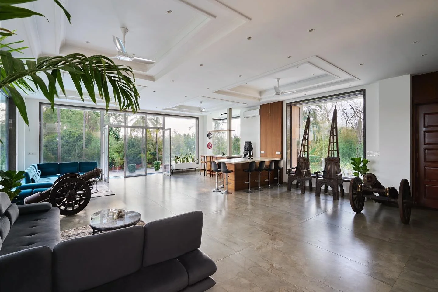 The open-plan living area,heart of the farmhouse, with floor to ceiling windows allowing a seamless flow between the indoors and outdoors.

Architectural design and planning, landscape and site development, and interior design by @sunilnagalassociate