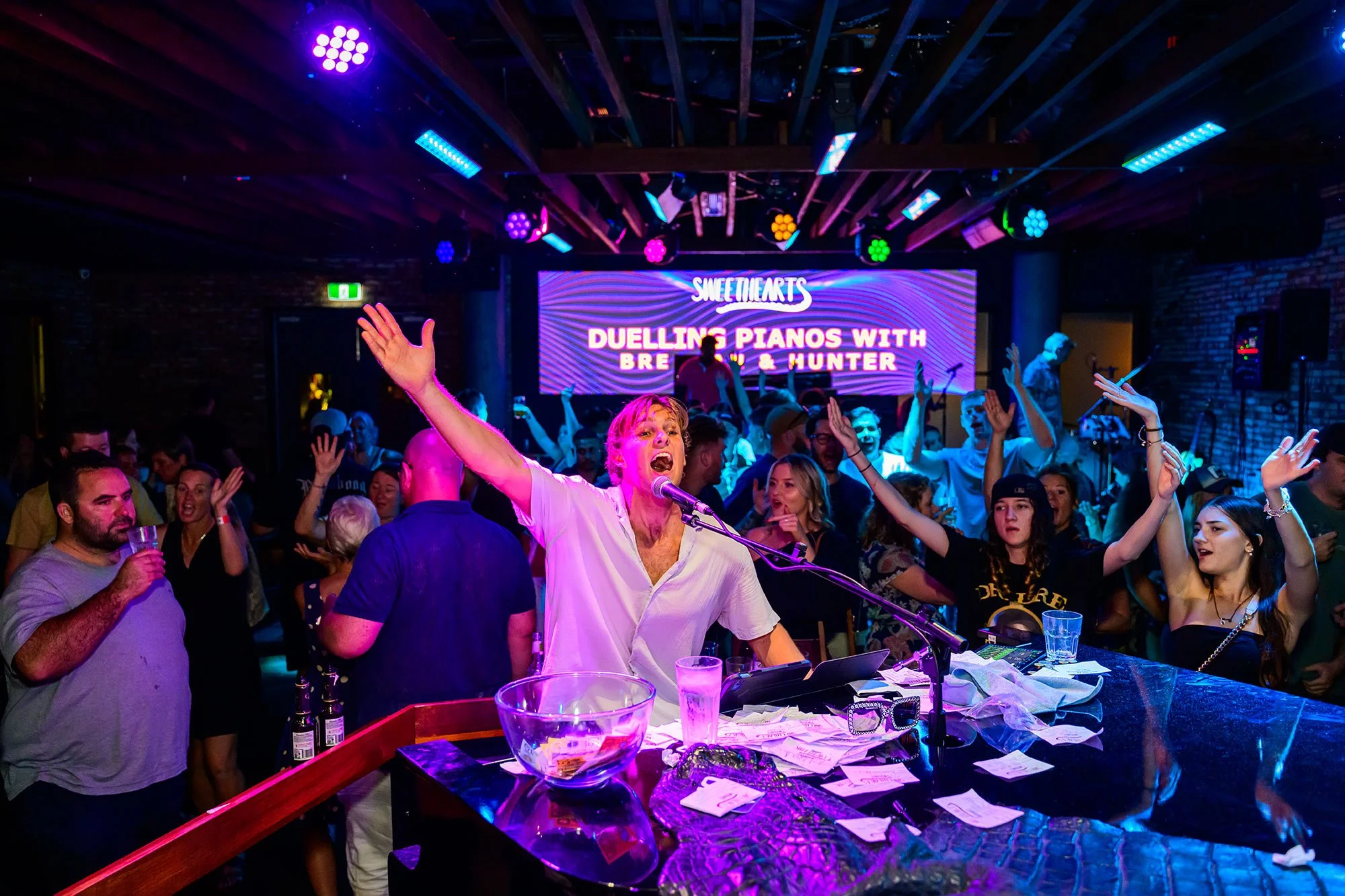 Hunter Black playing piano at "Sweethearts" in Darwin and playing also with Duelling Pianos with Brennan.