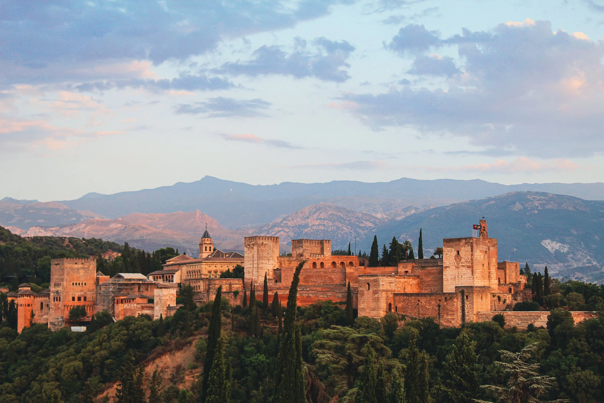 A view of Granada Spain and the mountains at sunset