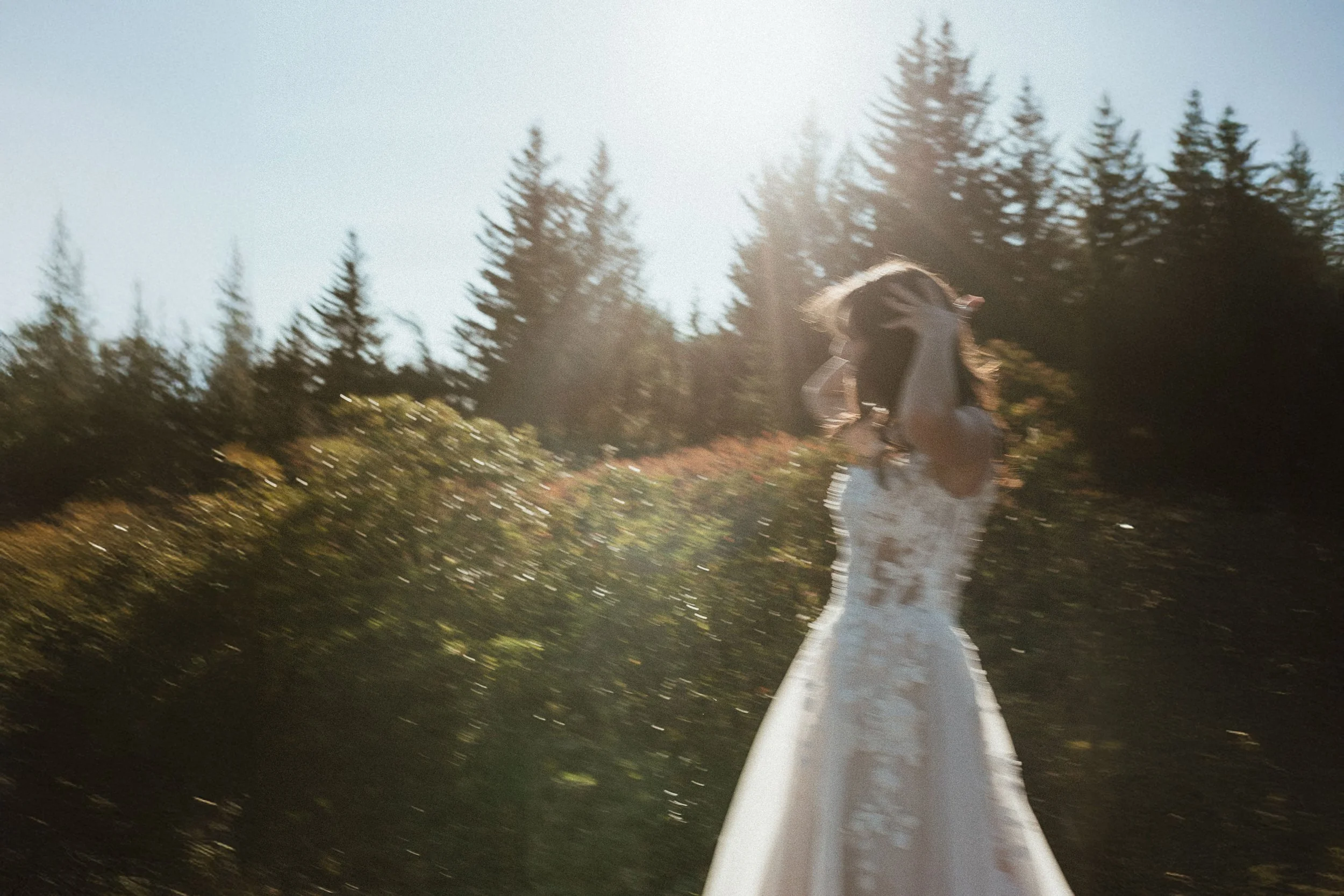 A bride dancing in golden hour light during her elopement in northern Spain.