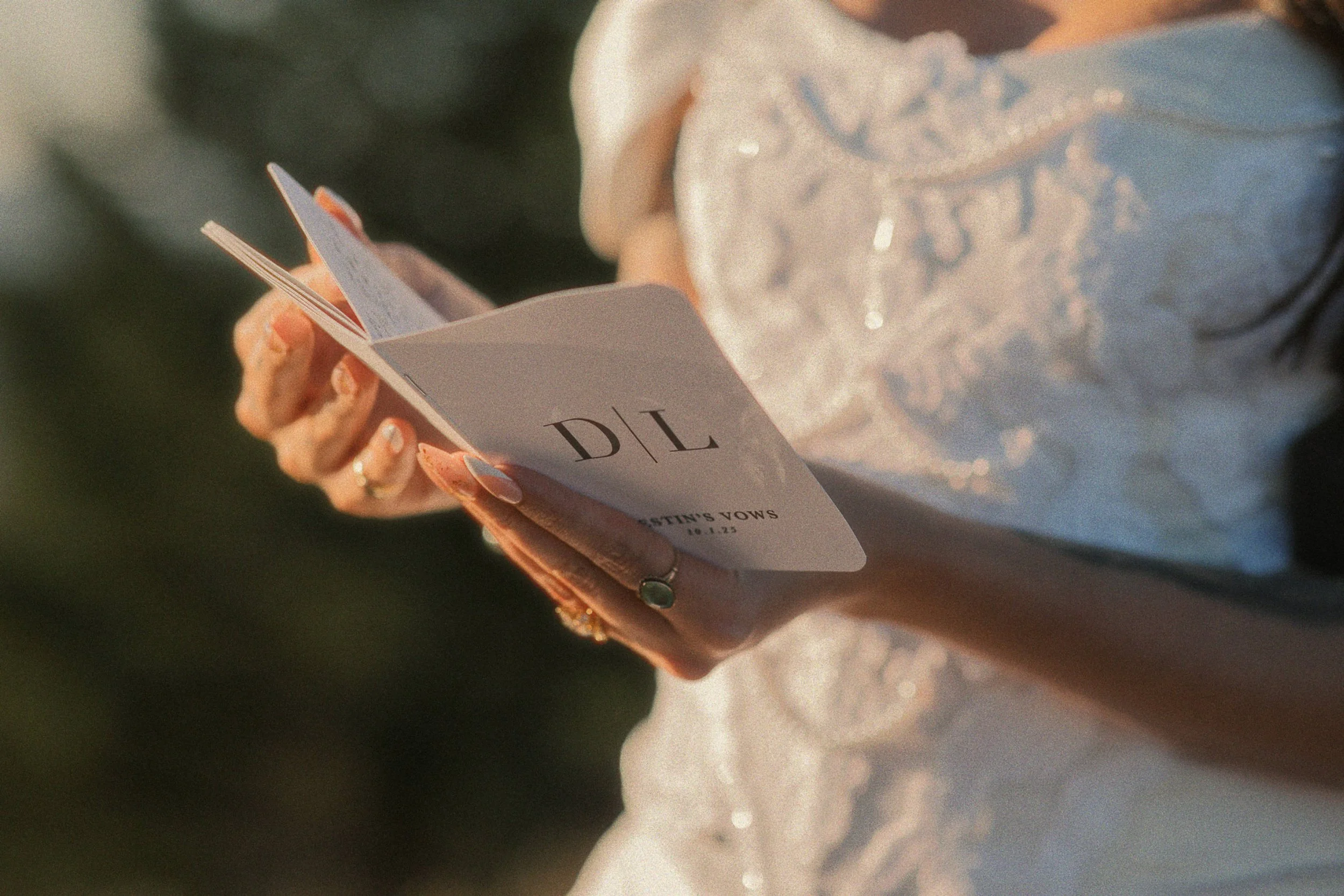 A bride reads her vows during a quiet symbolic vow ceremony on a mountain ridge in Picos de Europa at sunrise