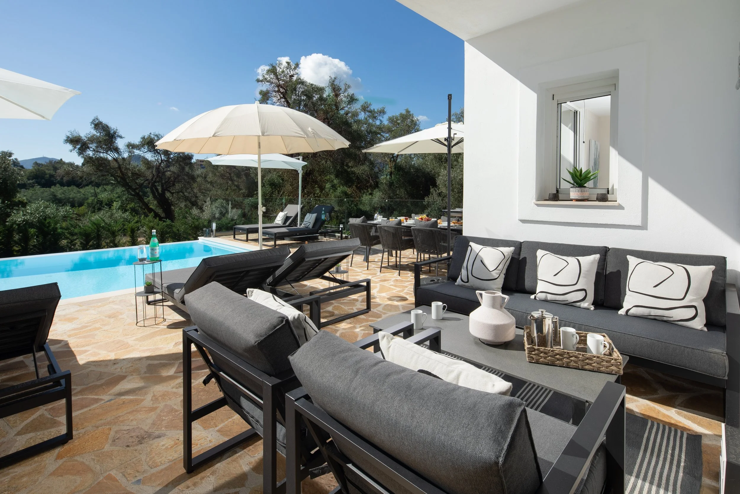 Outside seating area at Villa Icarus Corfu with morning coffee served. 