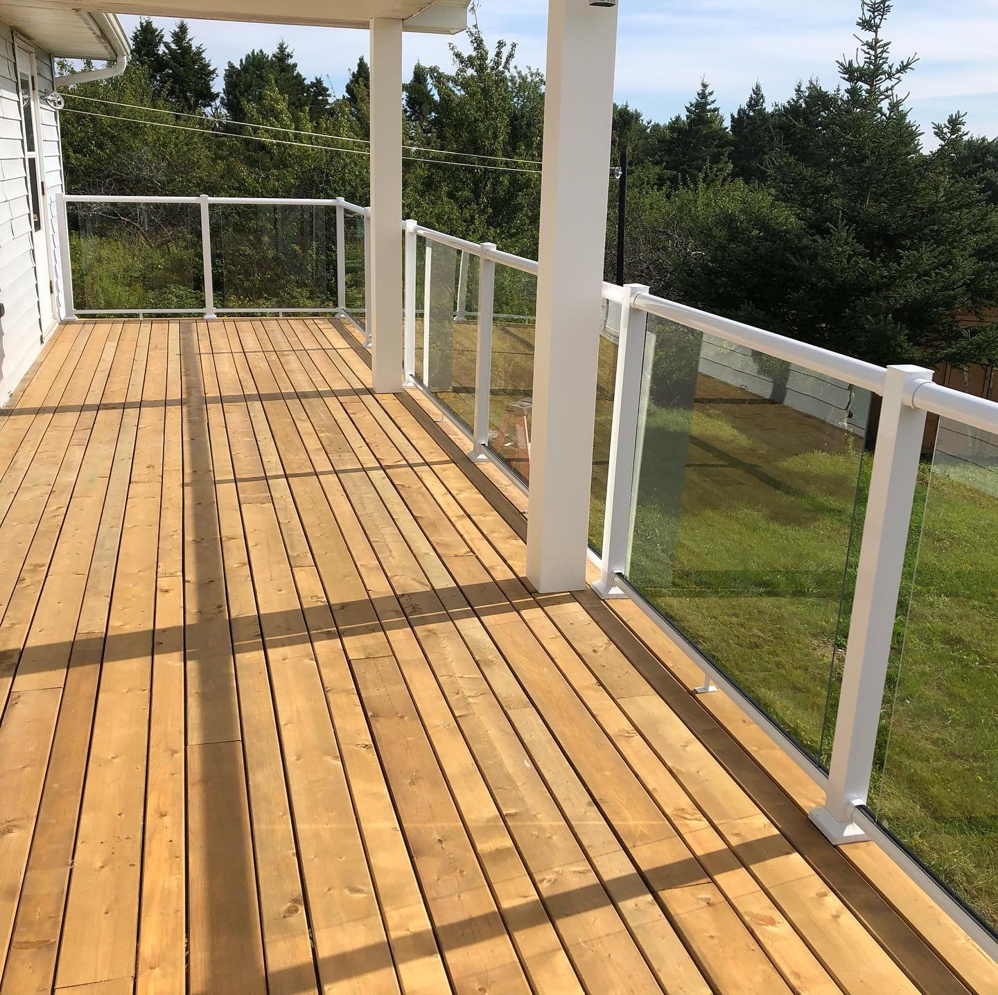 Alternated size deck boards with a faster-free surface, glass railing and versa column wraps #flawless 

#landscape #landscapephotography #contractor #deck #wood #glassrailing #work #novascotia