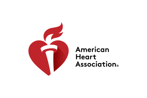The logo of the American Heart Association featuring a red heart with a torch inside and the text 'American Heart Association' beside it.