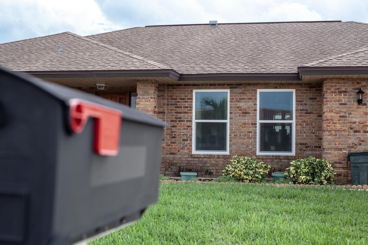 Make your brick house shine with white vinyl frames.