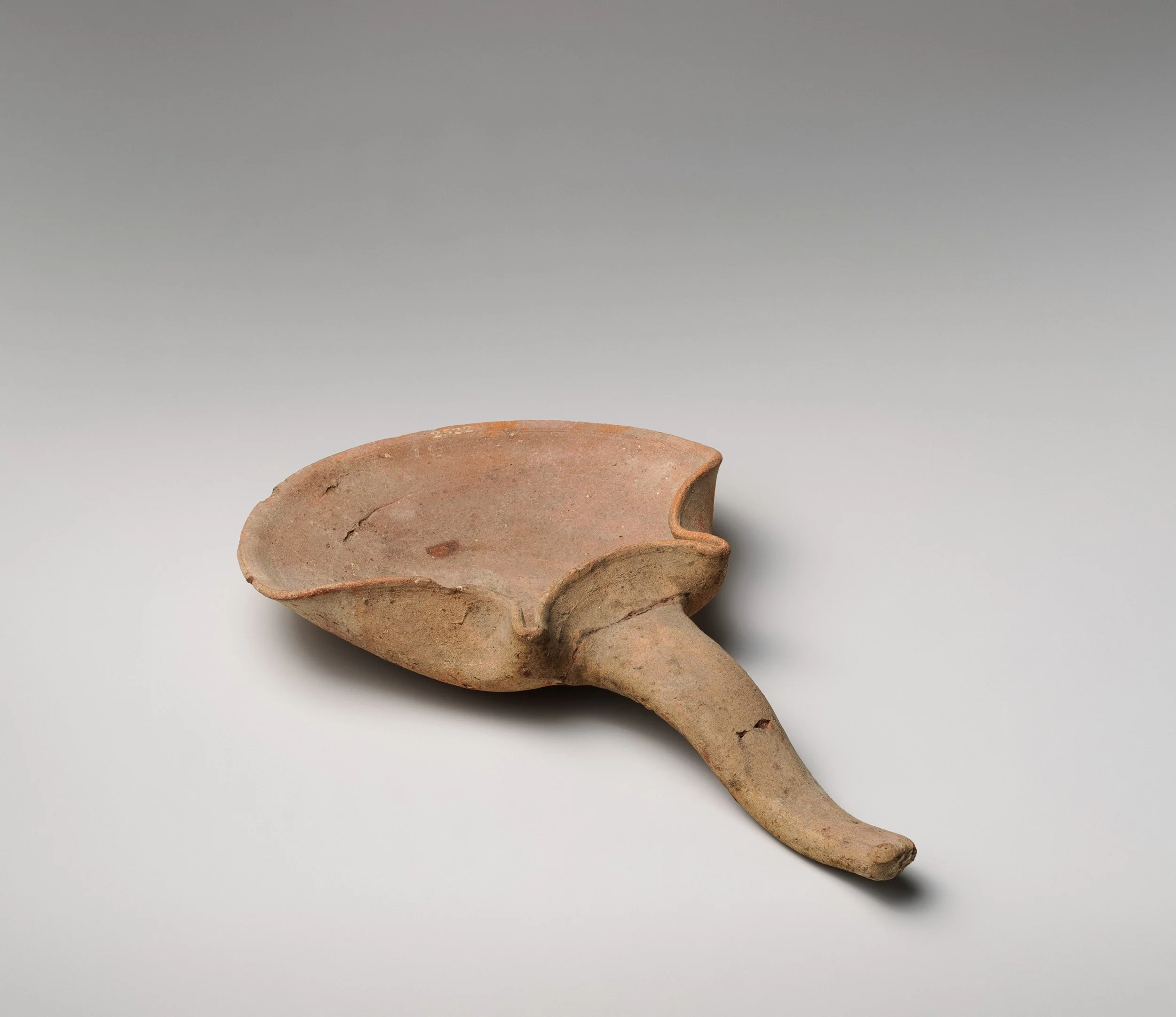 Terracotta handled saucer-shaped oil lamp 4TH CENTURY BCD.jpeg