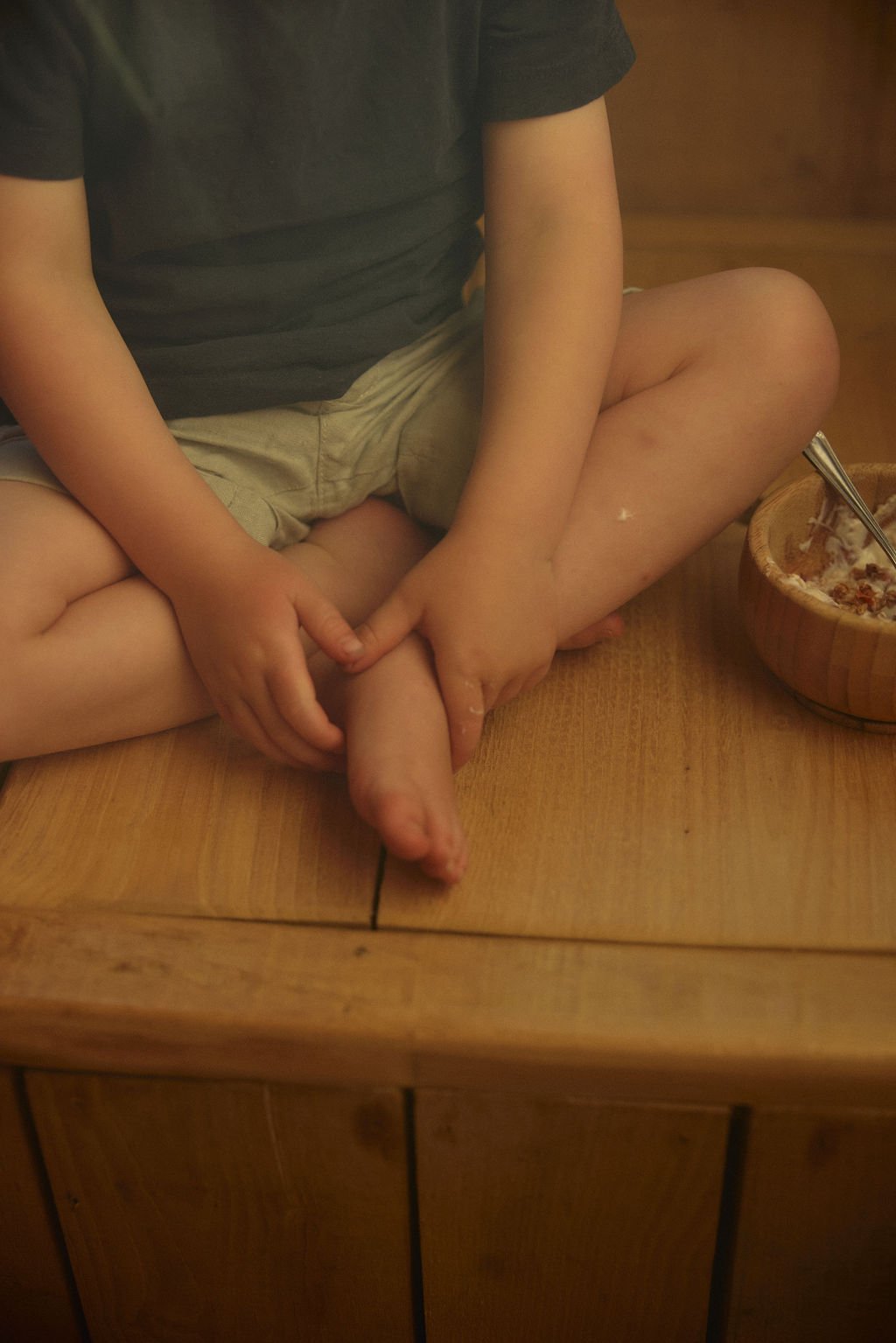 Child sat on table