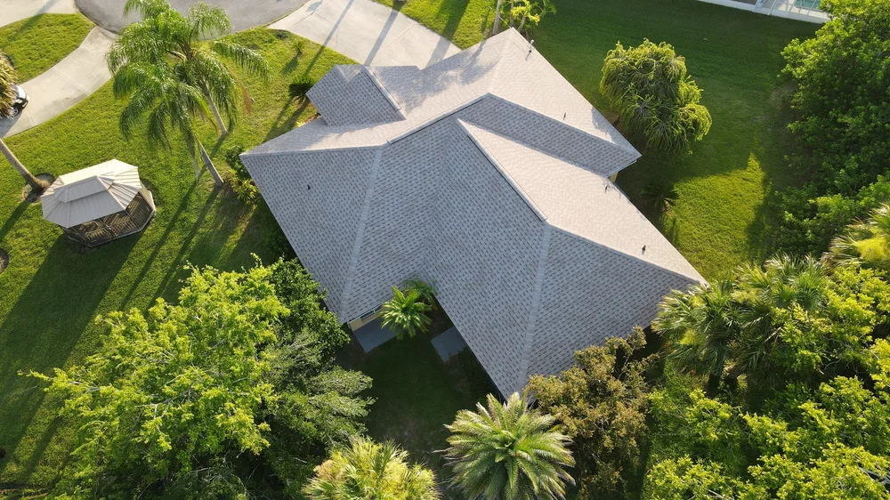 Aerial view of a new shingle roof installed by High Tide Roofing in Palm Coast, FL