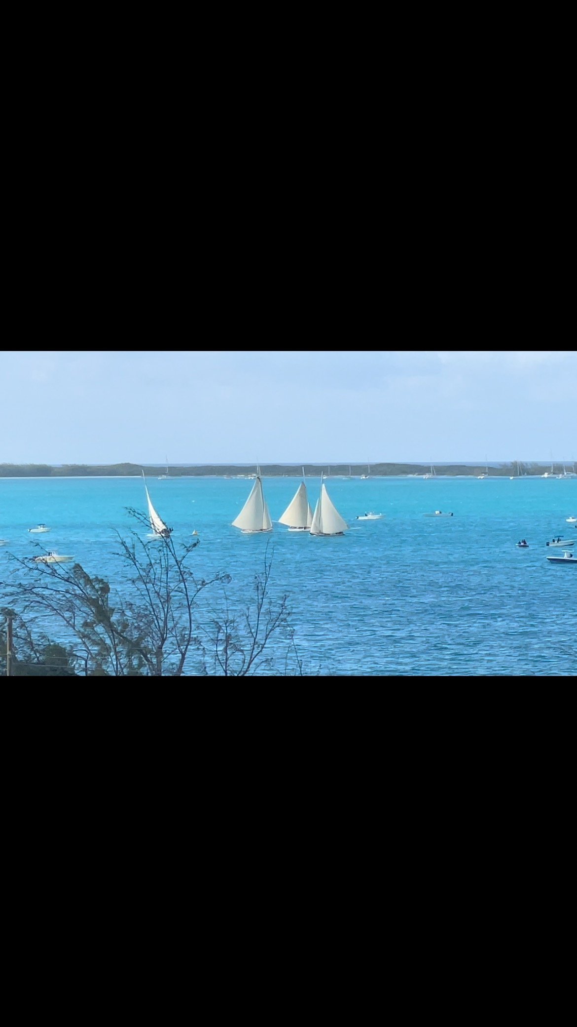 69th National Family Island Regatta, Exuma Bahamas. Prime Minister‘s Cup race on Wed., Apr. 23rd, Class “A” boats. Exumian boat Tida Wave with Skipper Brooks Miller would end up losing their lead due to their sail suffering a major