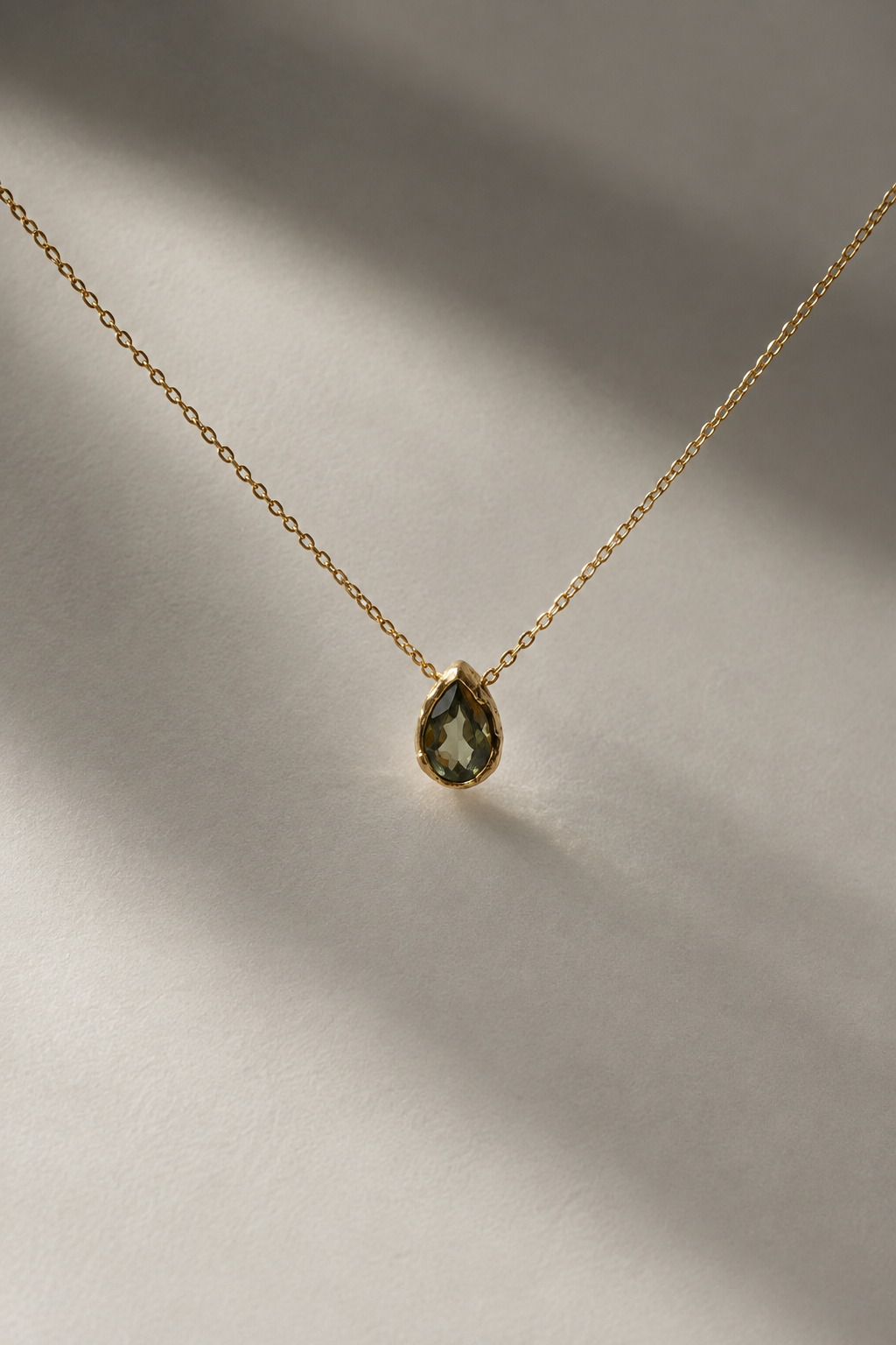 Studio-IRIS-tremor-pendulum-14kt-gold-tourmaline.png