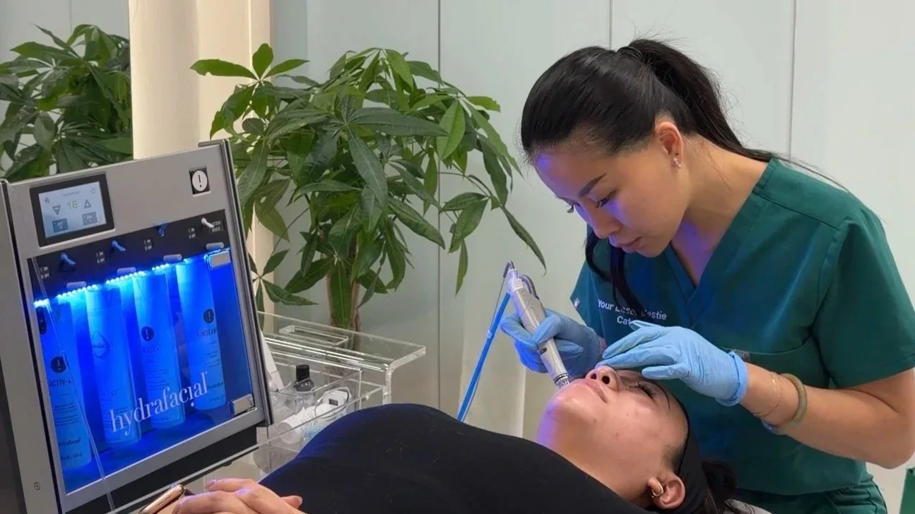 Client receiving a HydraFacial treatment at a Vancouver skin clinic