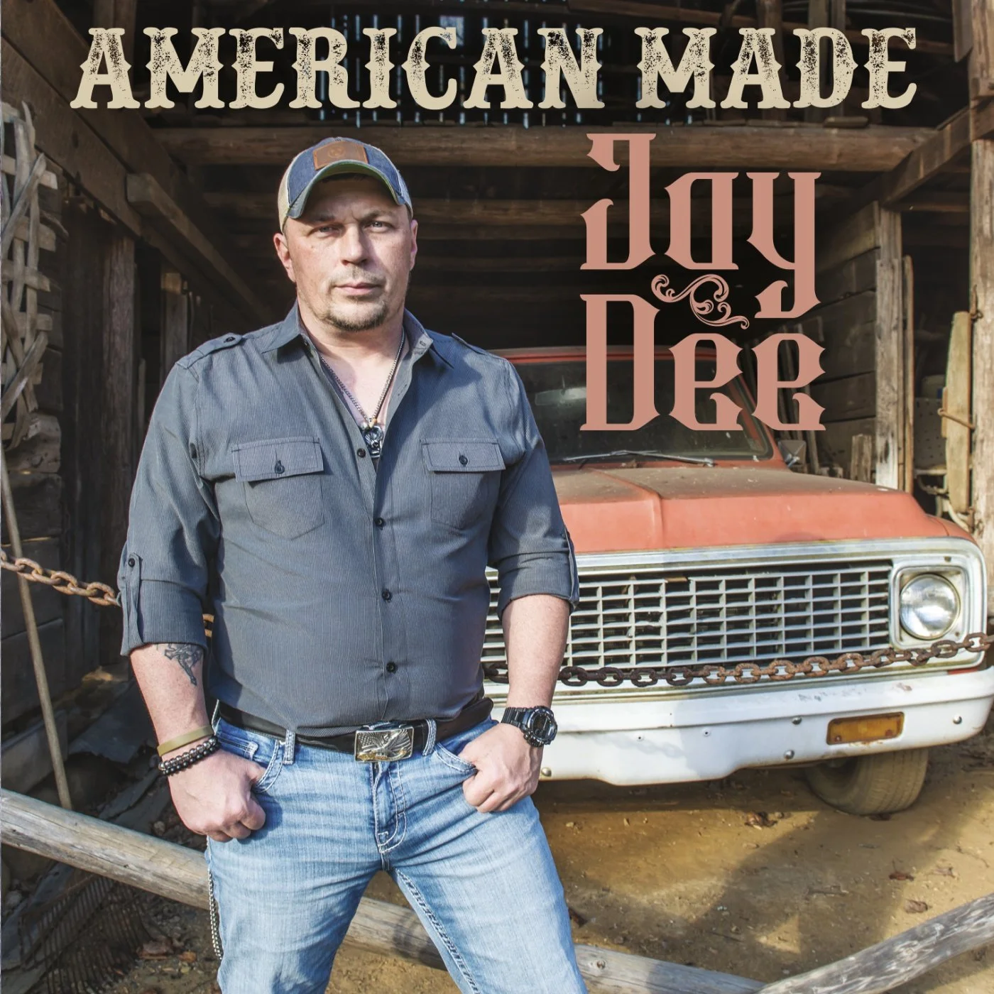 Jay Dee American Made album cover featuring artist standing in front of truck