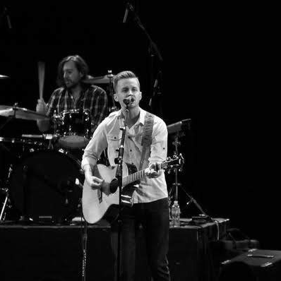 Micah Peacock performing live on stage