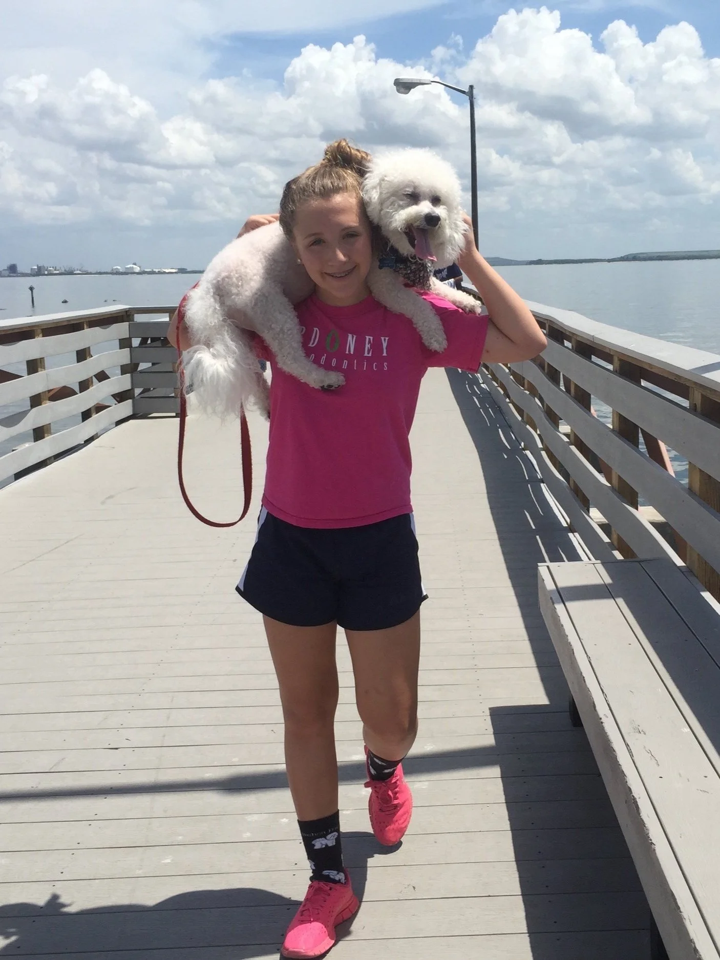 My childhood dog and I walking on a Tampa pier