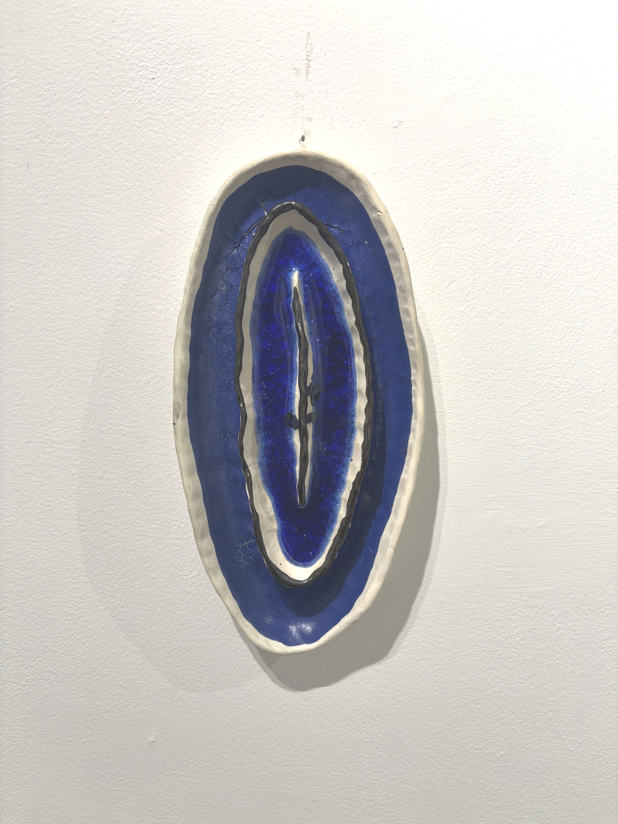 "Ovals and circles blue pools with ridges and lines the depths of soft joy" $200
