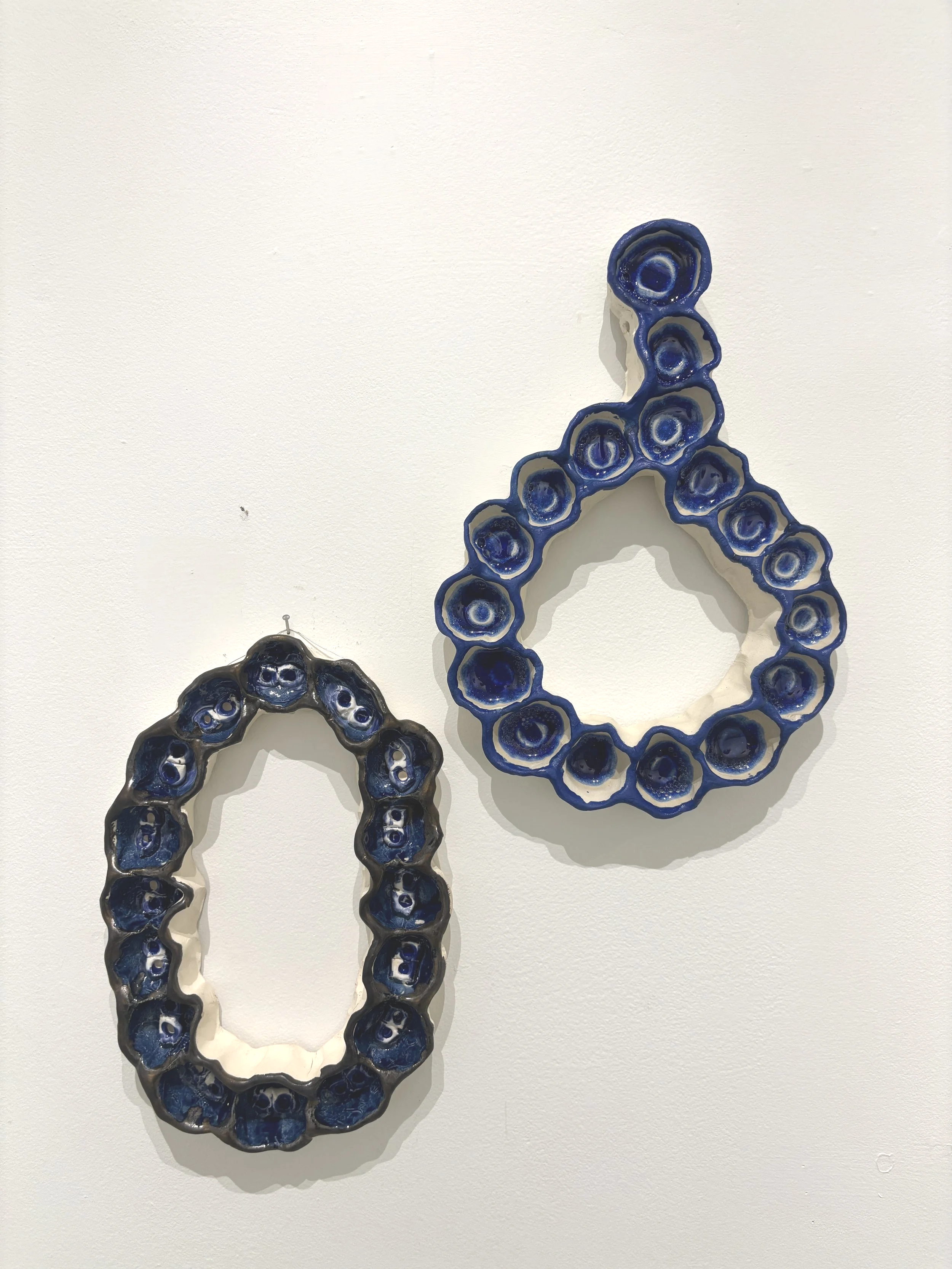 "Clay rope of blue light tied with dreams and hope and tears wound in hopes of spring" $300