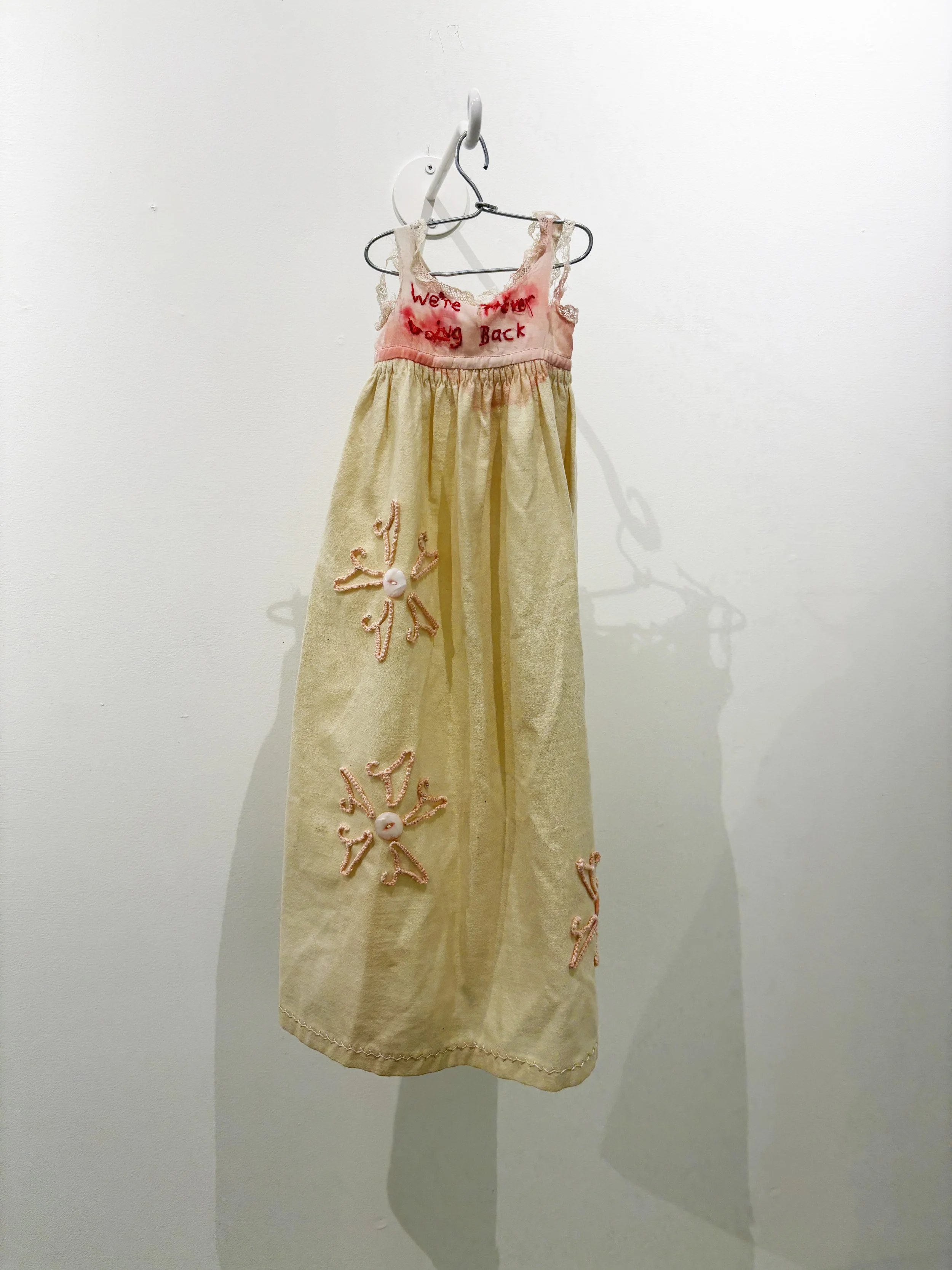 "We're . . . Back"
discarded dress, notions, hand-tatted doll hangers
$1500.