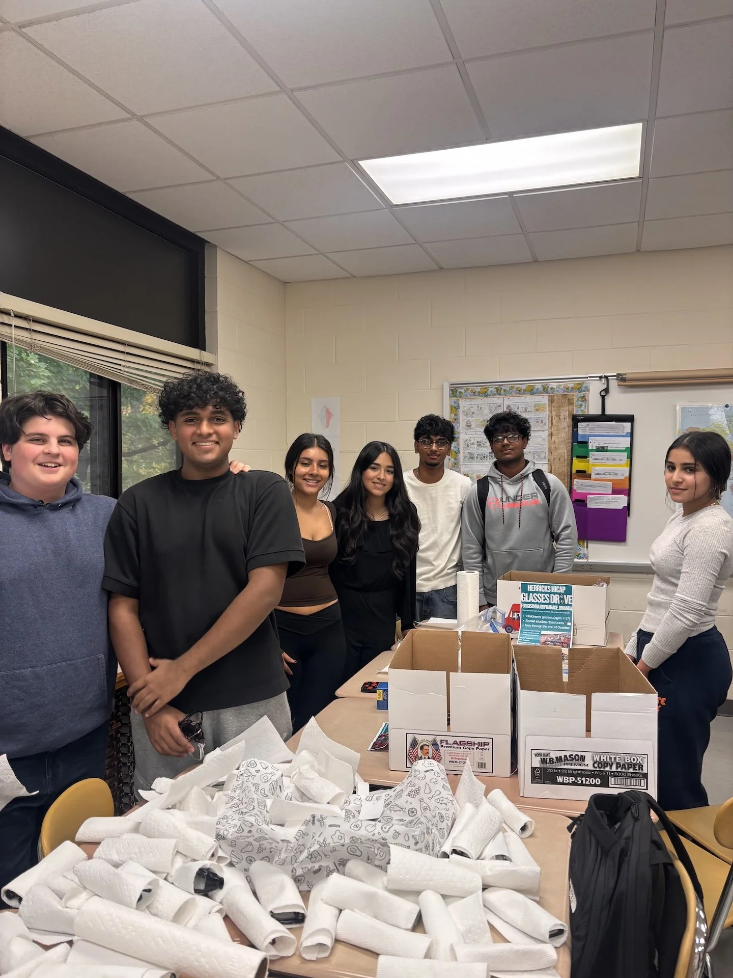 2- Herricks HS students prepare donated eyeglasses for shipment to Rwandan orphanage.jpeg