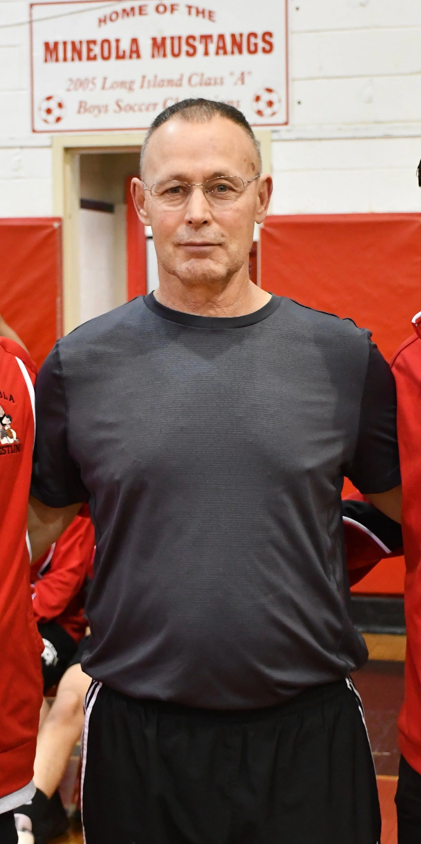 1- Mineola wrestling coach Dan Guido celebrates 400 career wins.jpeg