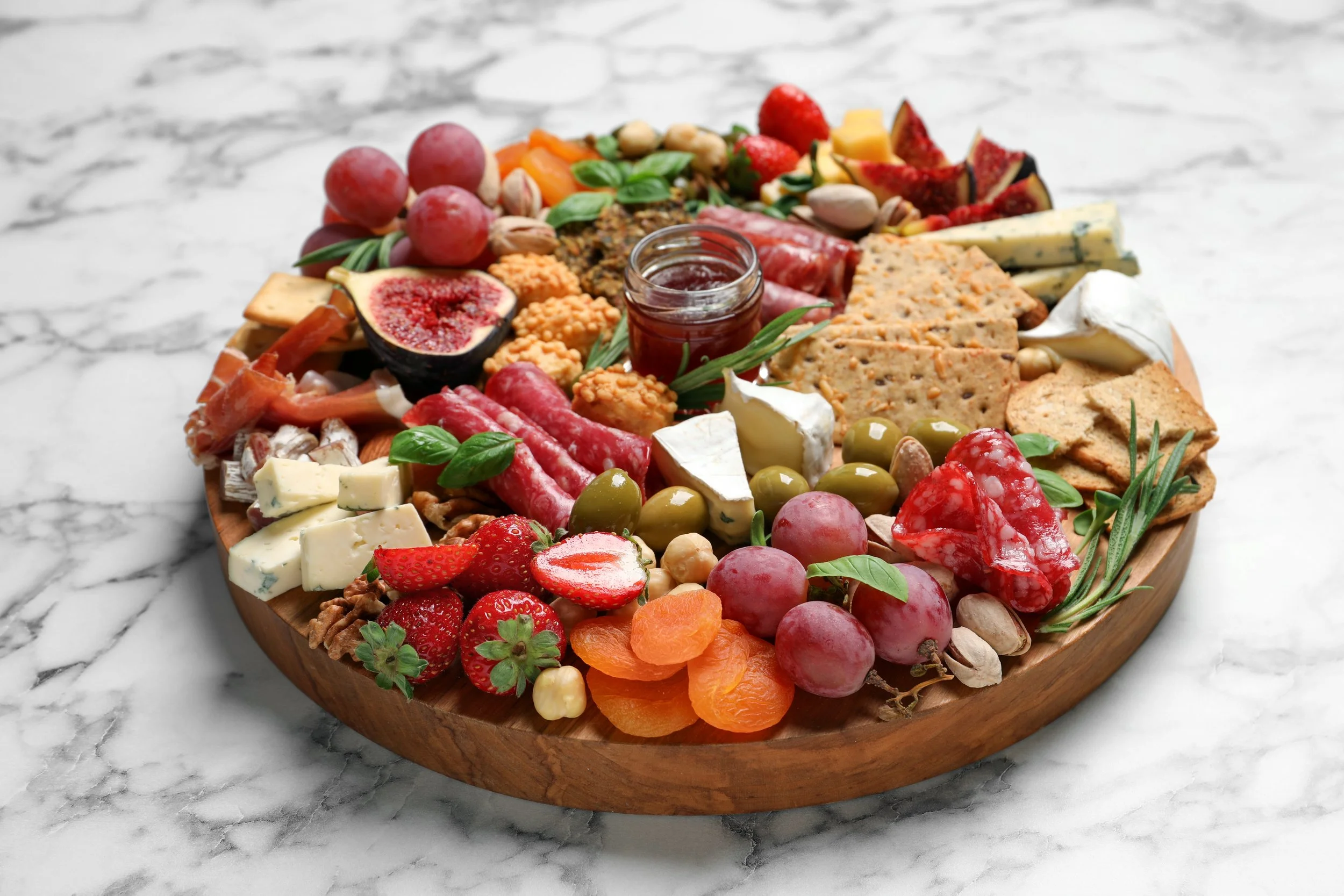 different-tasty-appetizers-on-white-marble-table-2026-03-09-02-51-58-utc.jpg