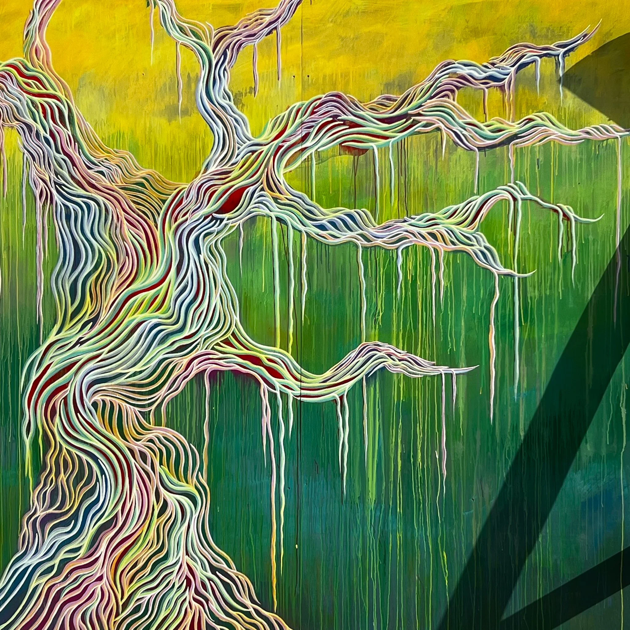 Colorful street art mural of intertwined, flowing lines resembling tree branches or roots, with a yellow-green background and drips of paint.