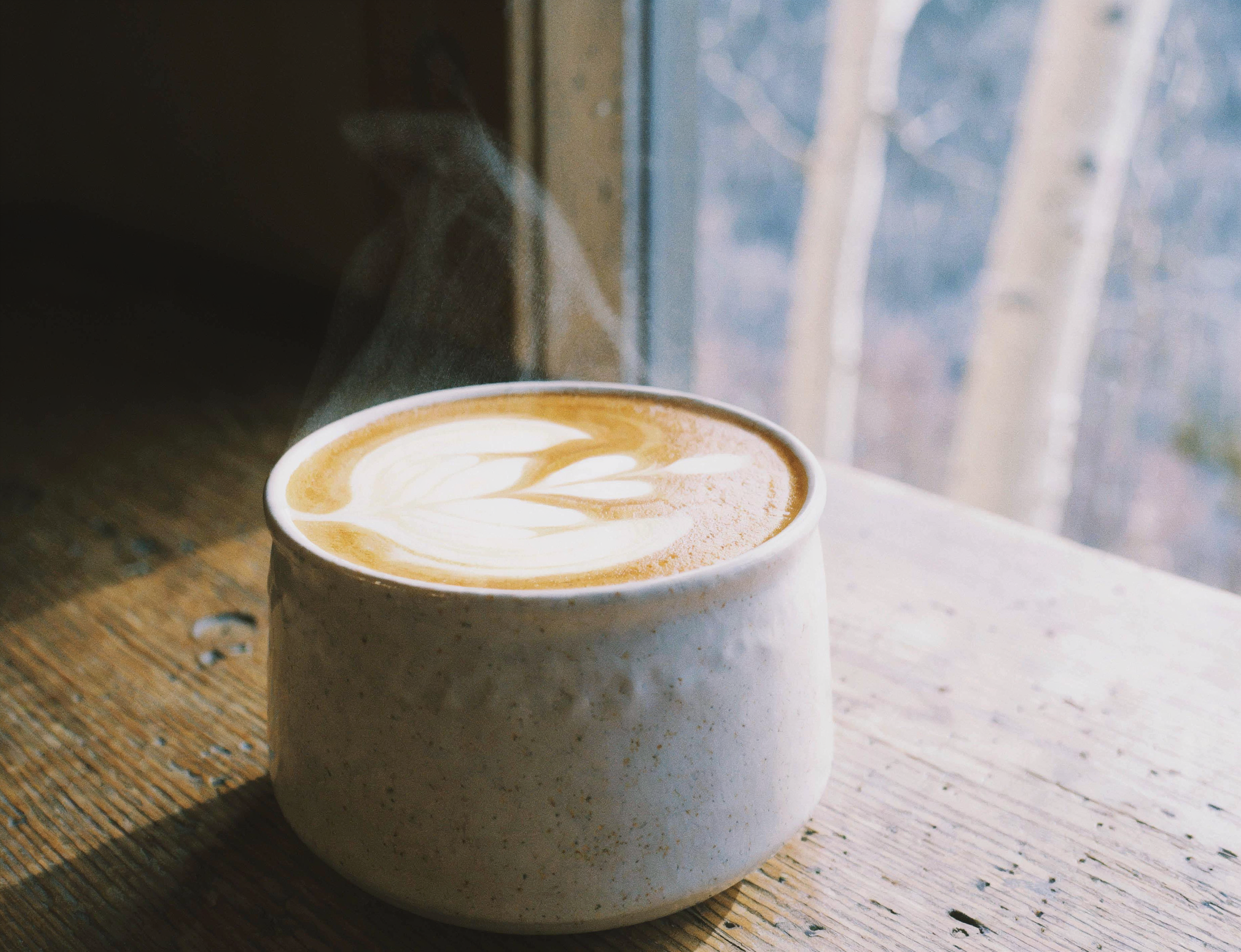 Close up latte in mountain cabin