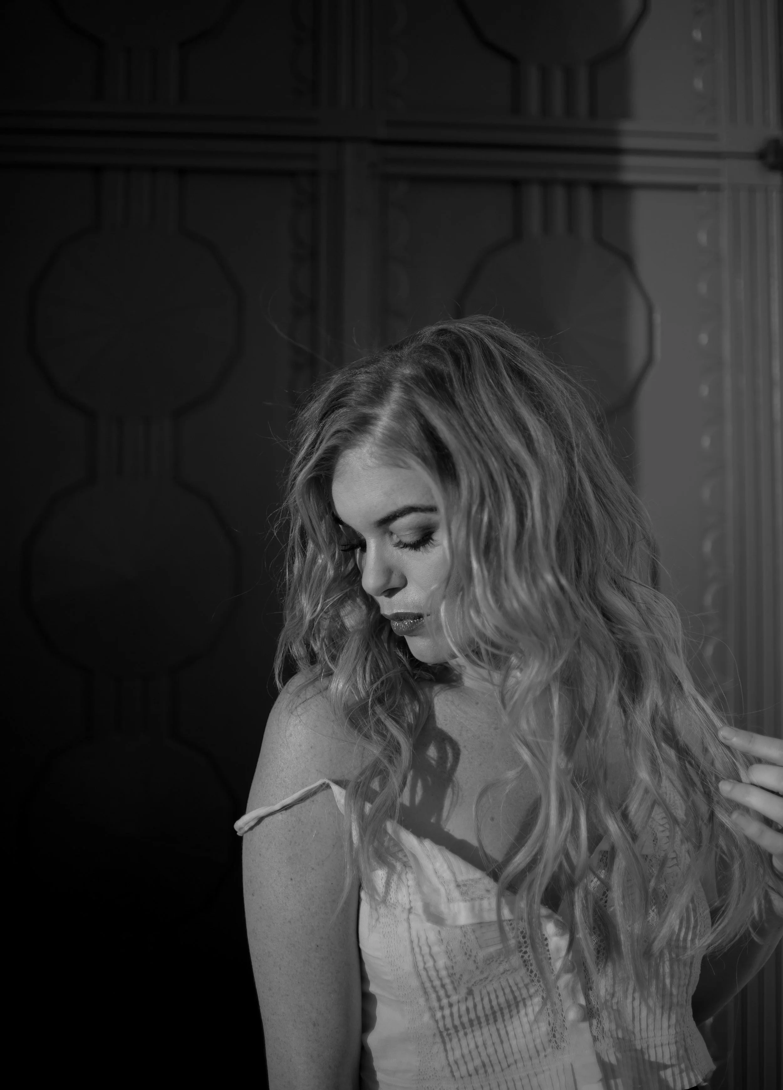 blonde haired woman wearing white top posing for a fashion photo shoot at griffith observatory