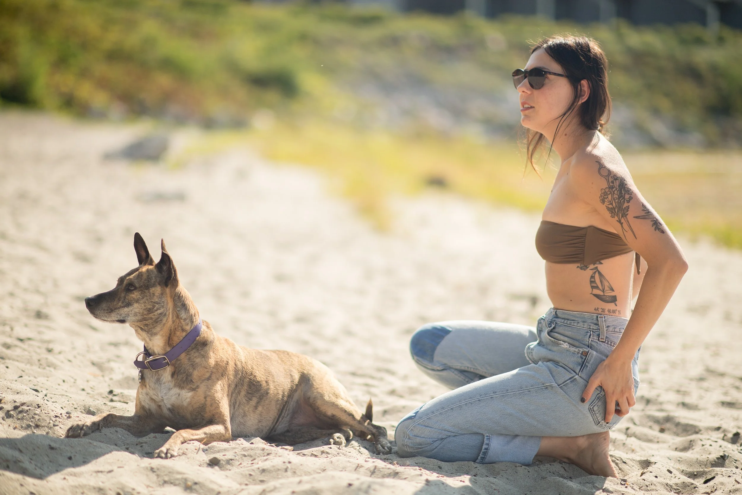 woman and her dog on a Burlington vt beach