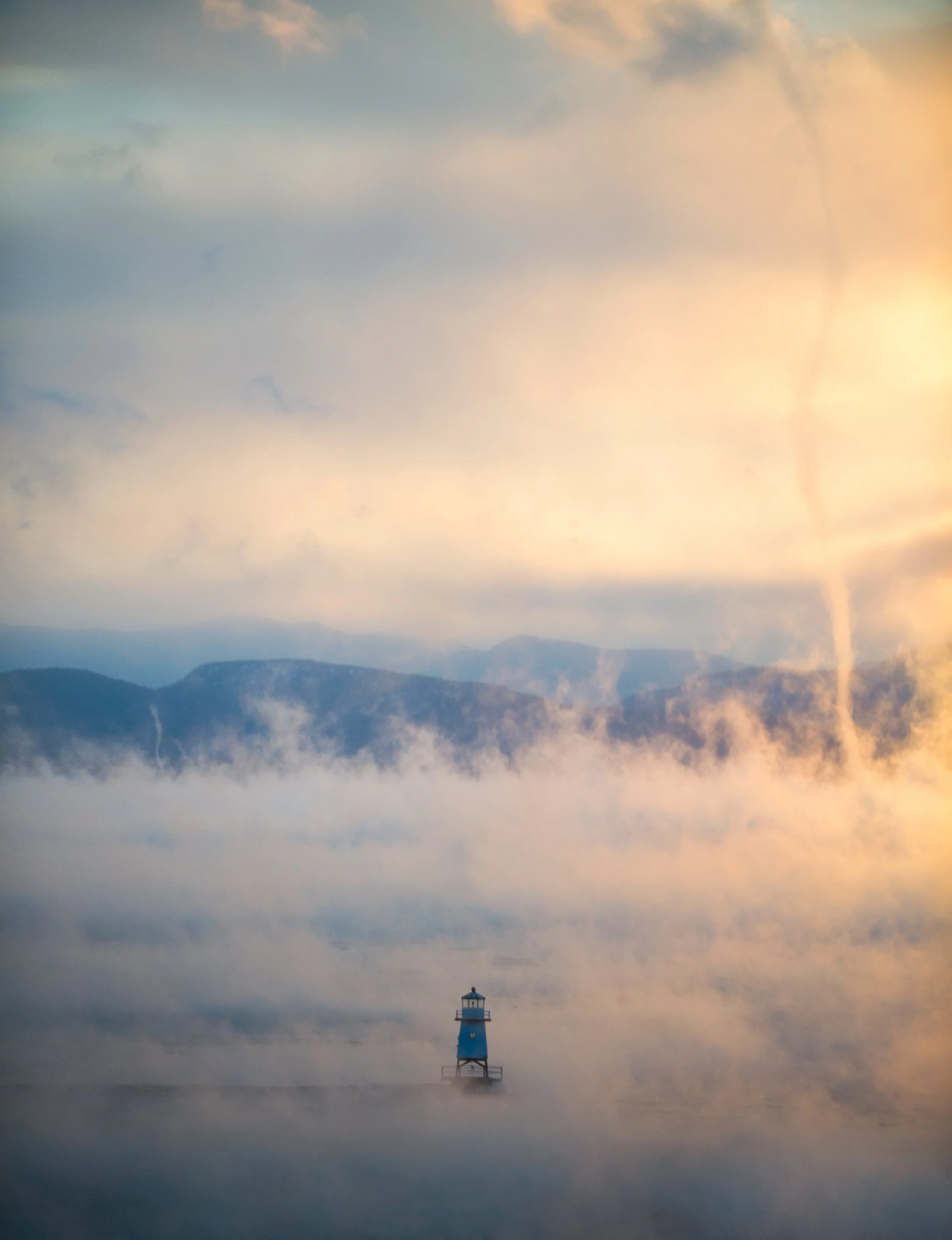 sea smoke rising from Lake Champlain in Burlington Vermont on a cold winter day at sunset