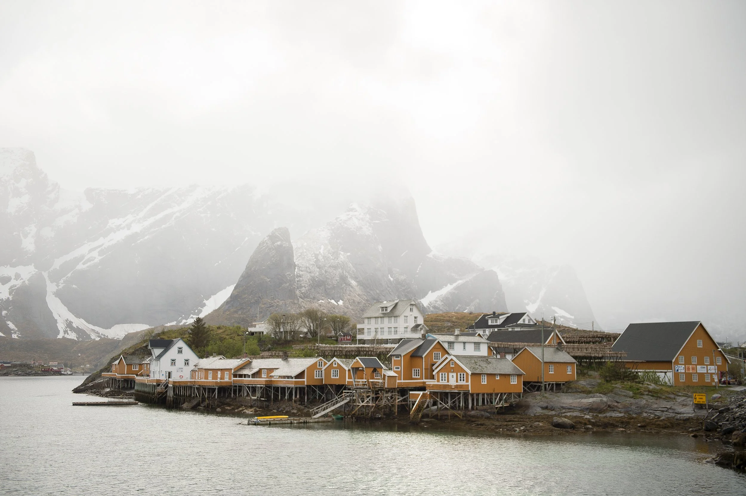 dramatic and foggy sky over a lofoten fishing village in norway