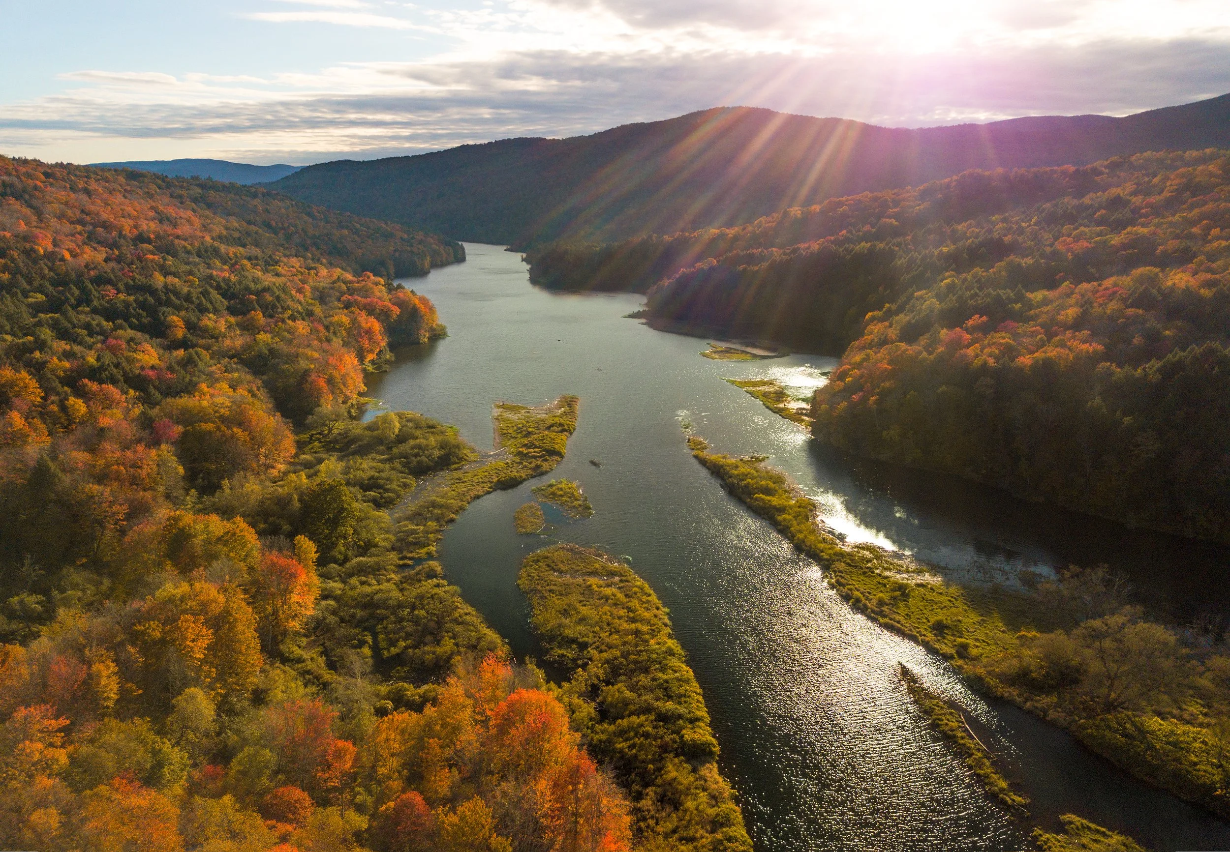aerial drone photography of waterbury reservoir with fall leaves