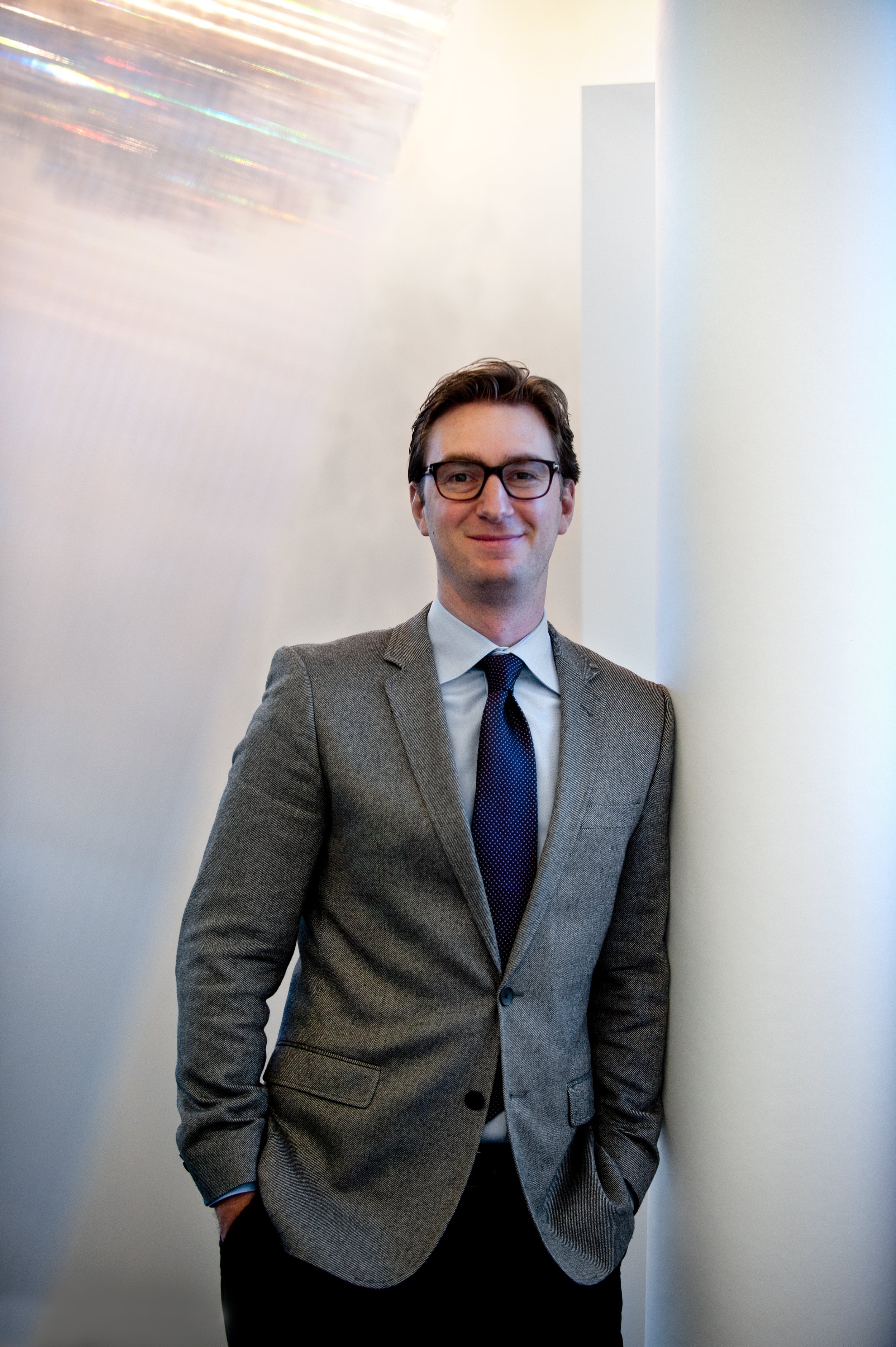 male swarovski lighting employee poses for portrait