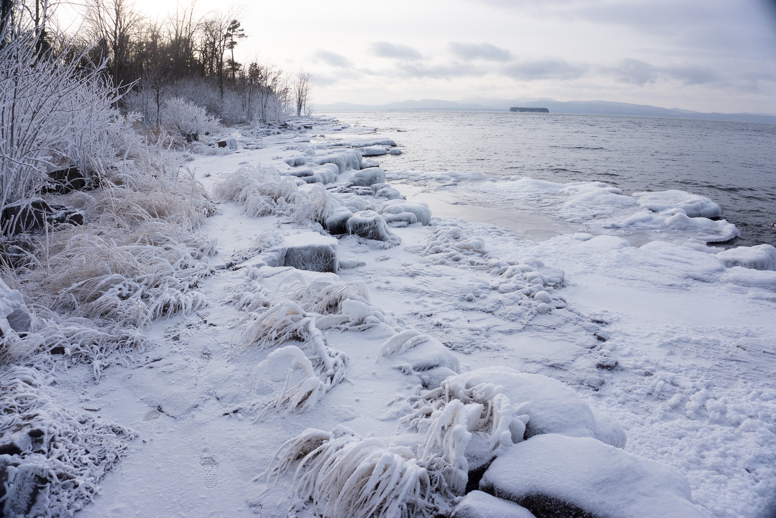 ice covered shore of oakledge park on lake champlain in Burlington vermont