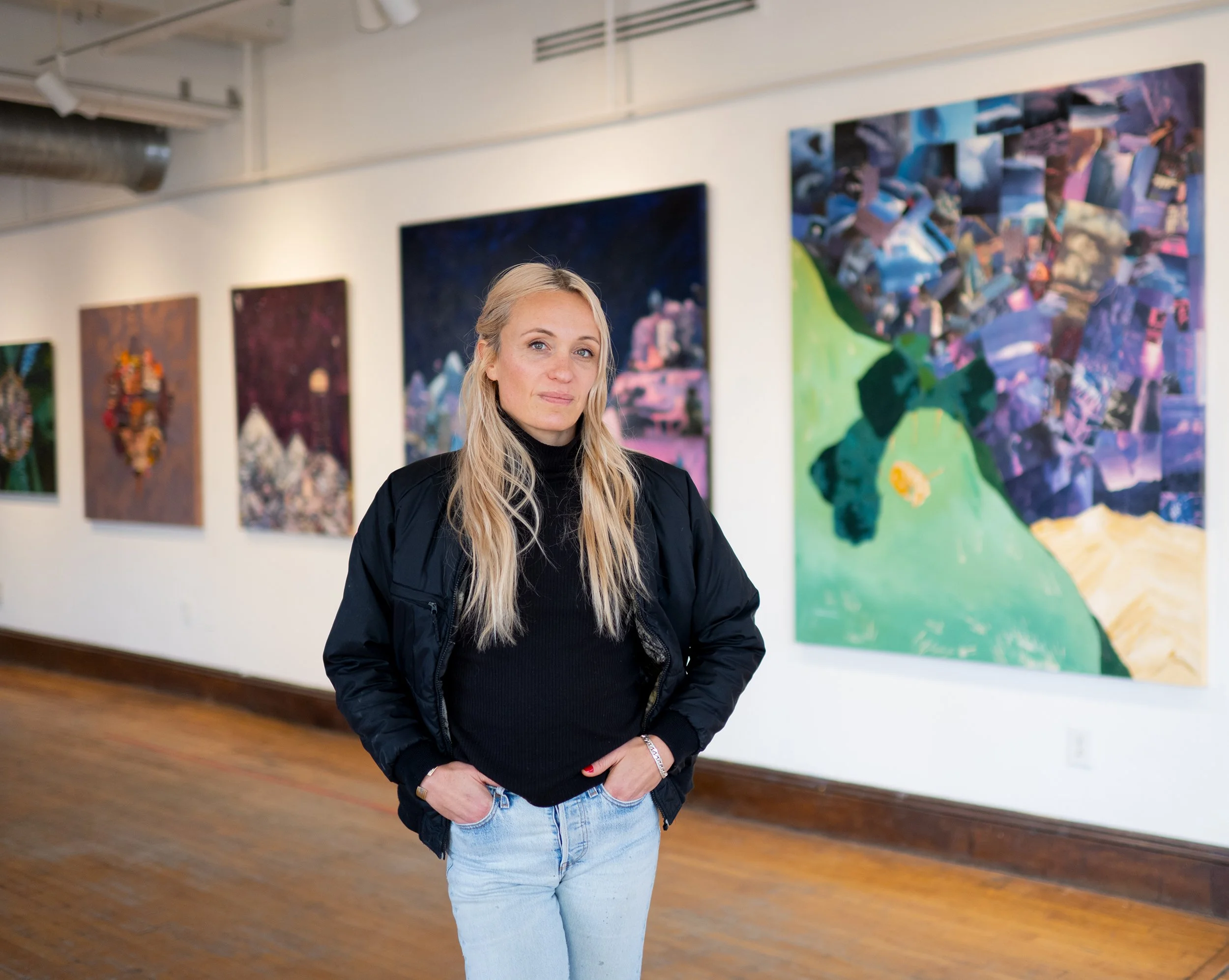 portrait of artist vanessa compton in front of her artwork