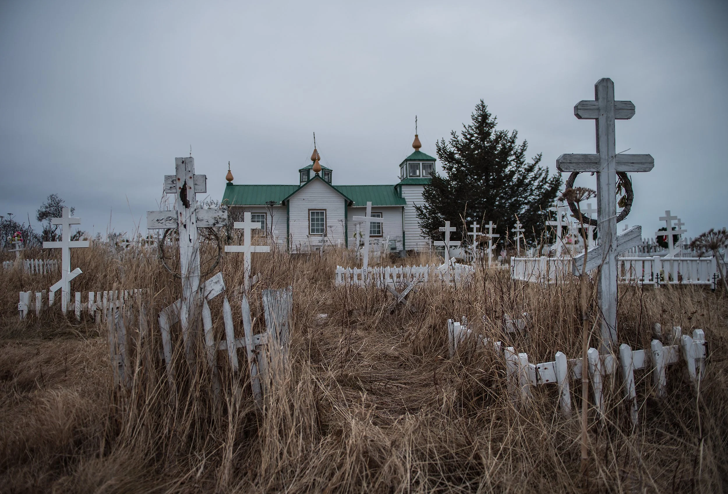 russian church and overgrown graveyard in alaska