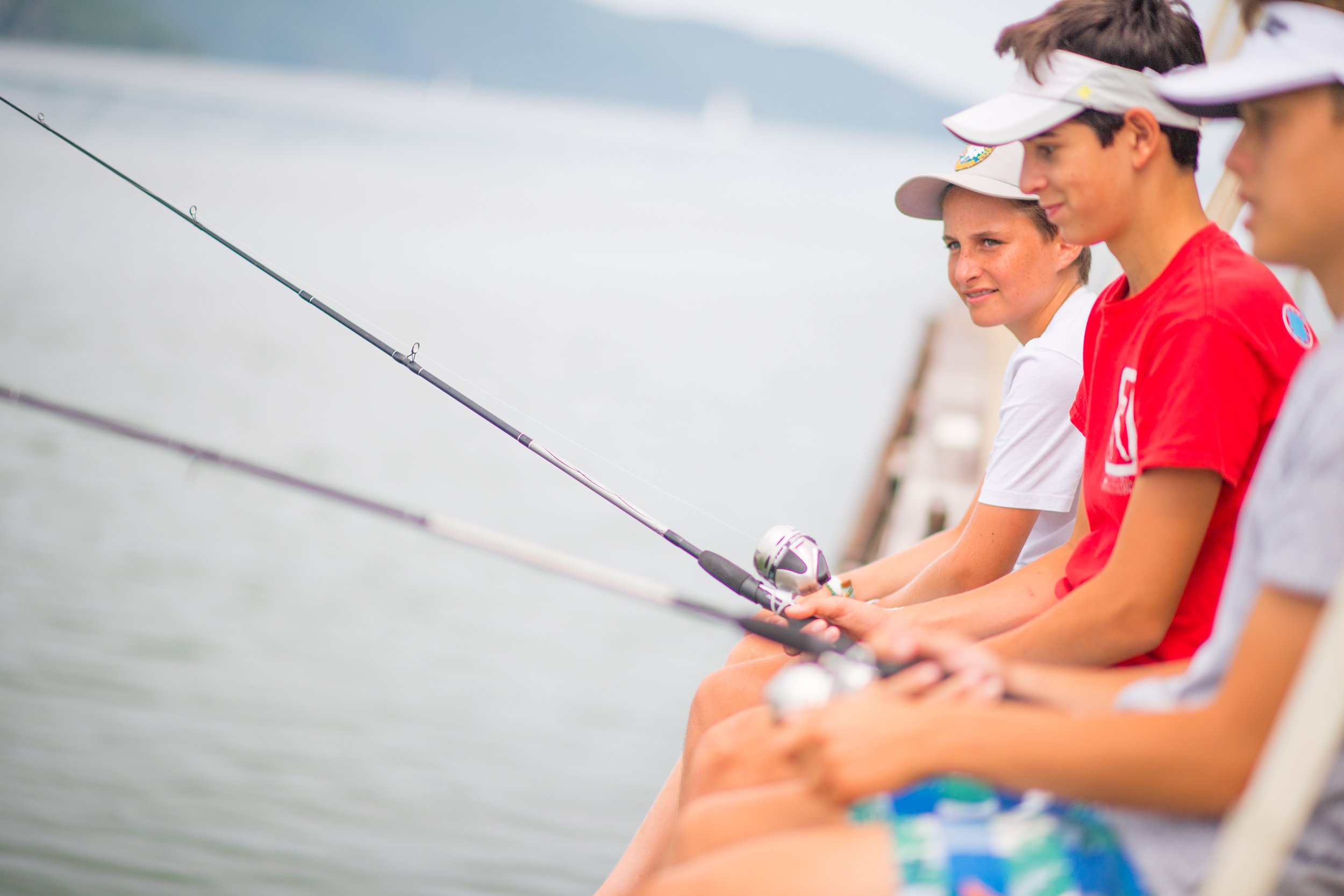 three boys fishing