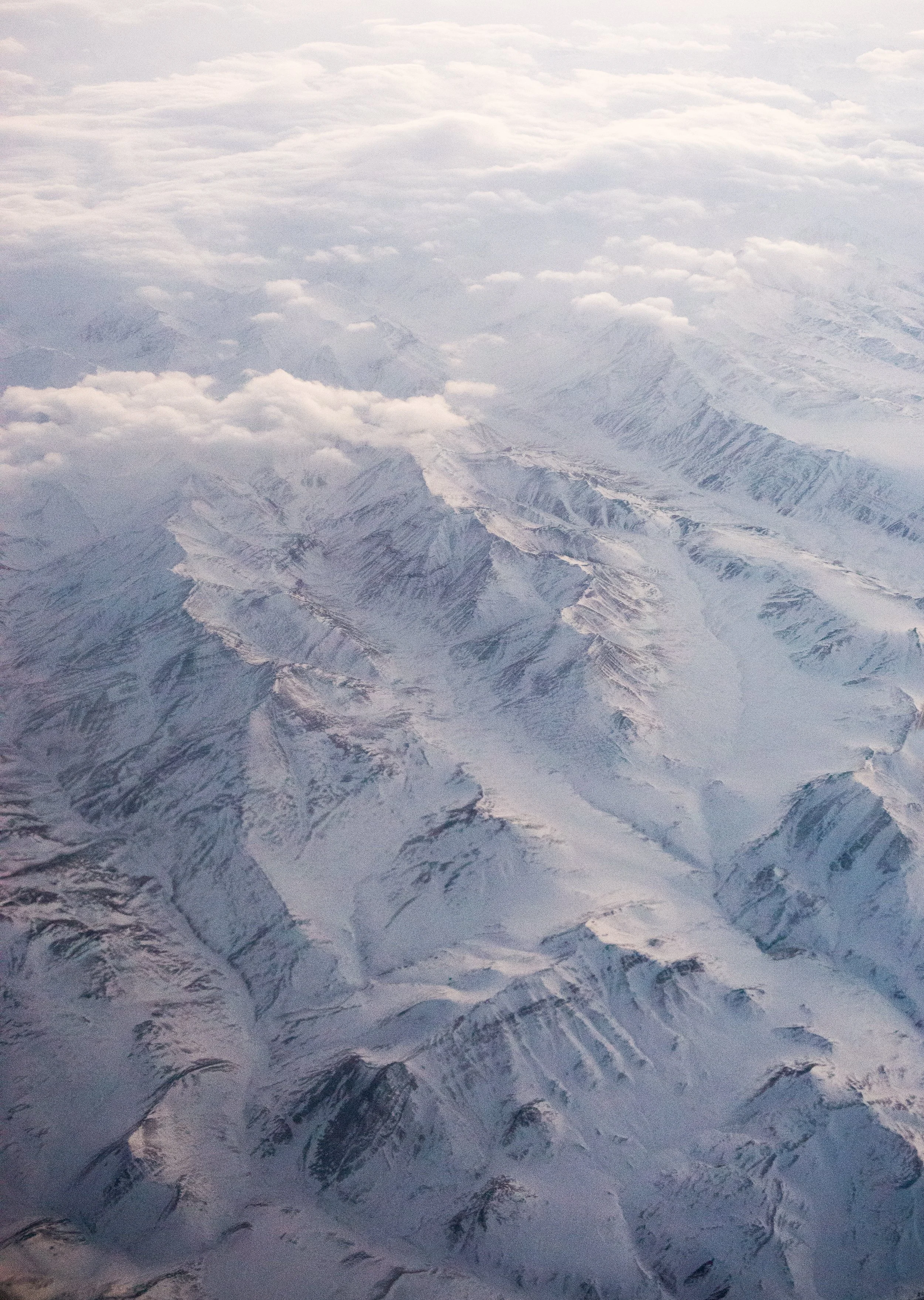aerial view of snowy alaskan mountain range