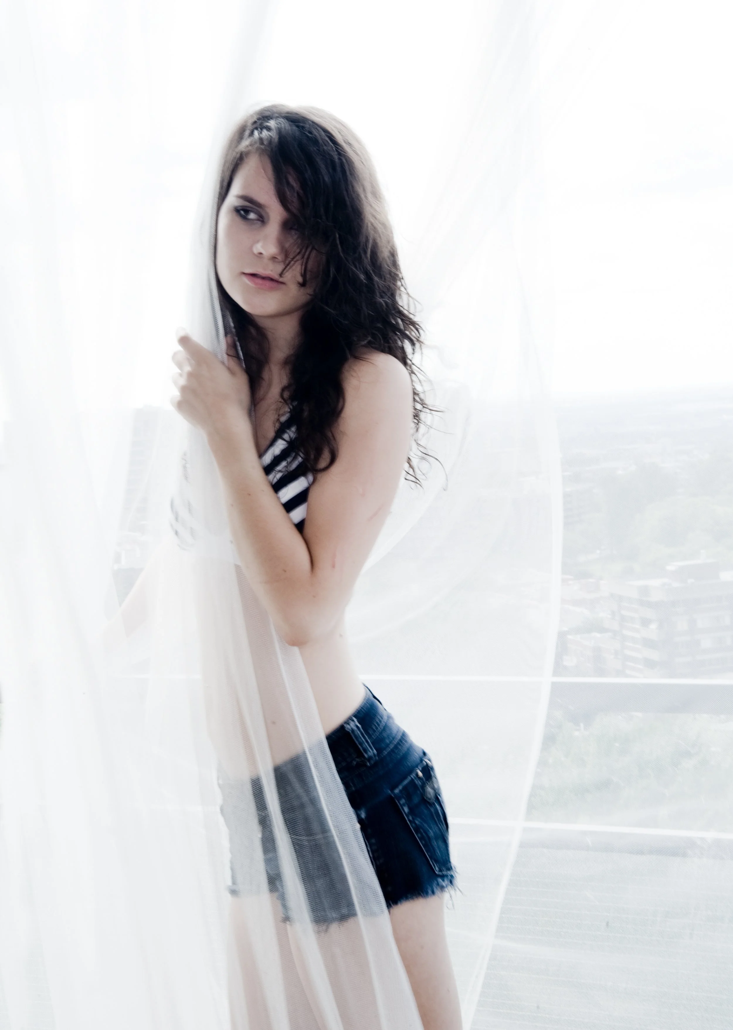 fashion model in front of window in montreal quebec