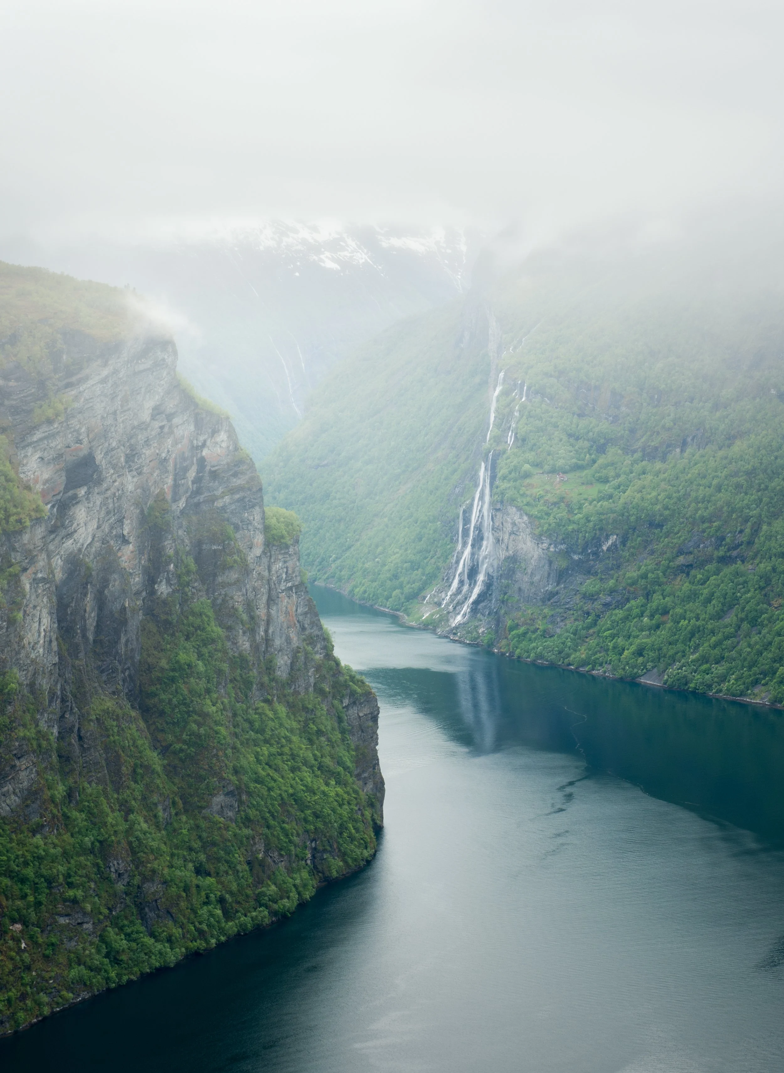 landscape photography of a foggy fjord in norway