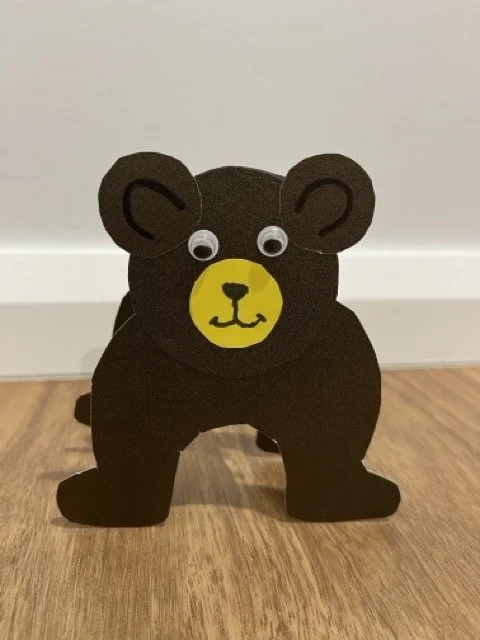 A small bear made from paper with googly eyes. crafting can support language and executive functioning