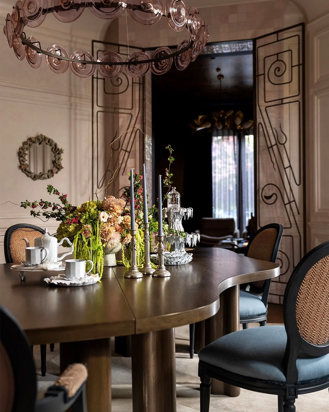 A Gated Space by Stephanie Marsh Fillbrandt of @marshandclark

Inspired by the rounded bay window that quietly suggested the Victorian origins of the dining room, Stephanie created a carefully layered interior, where wood paneling, striking iron gate