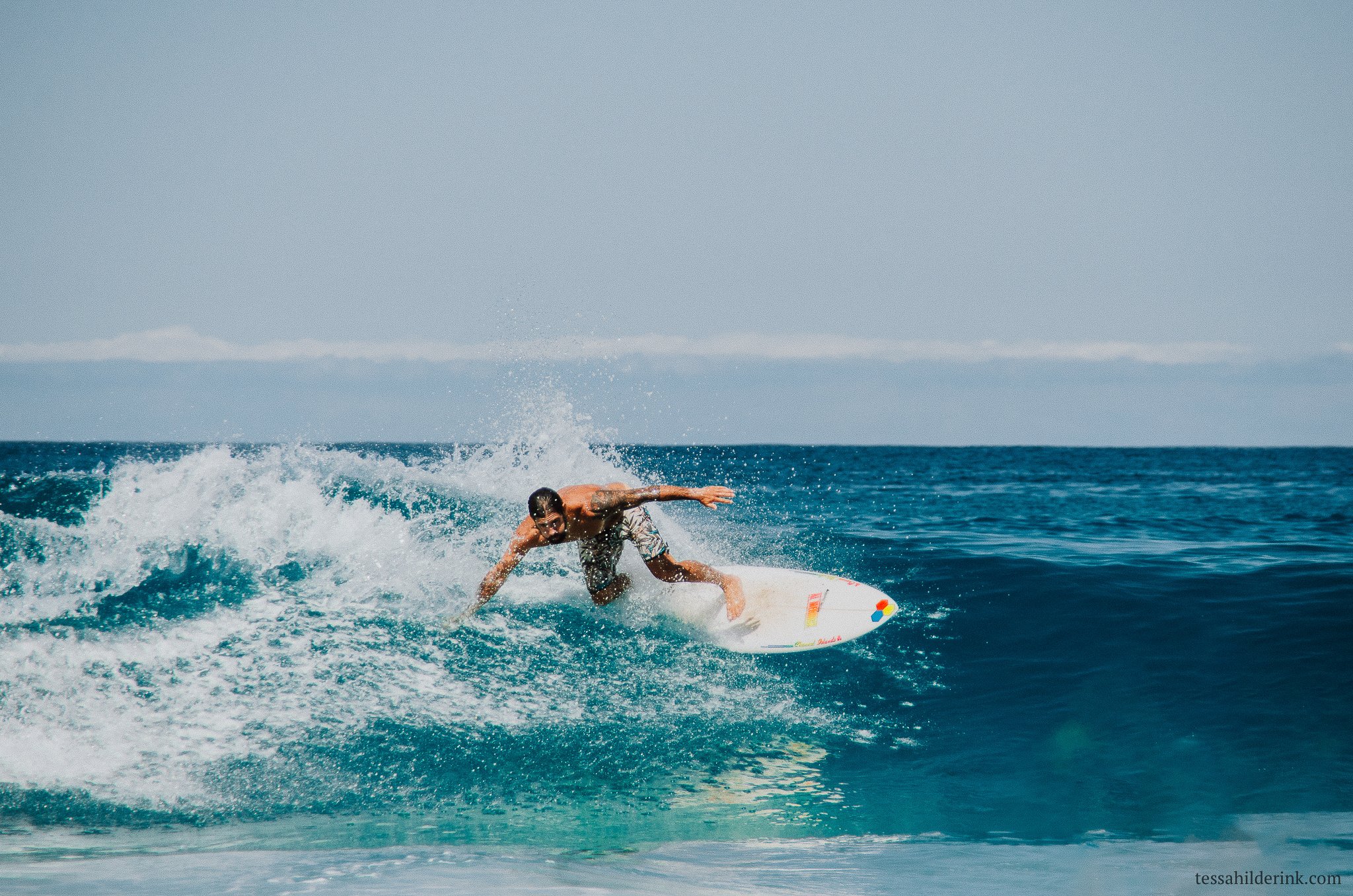 Surfer riding a wave in the ocean