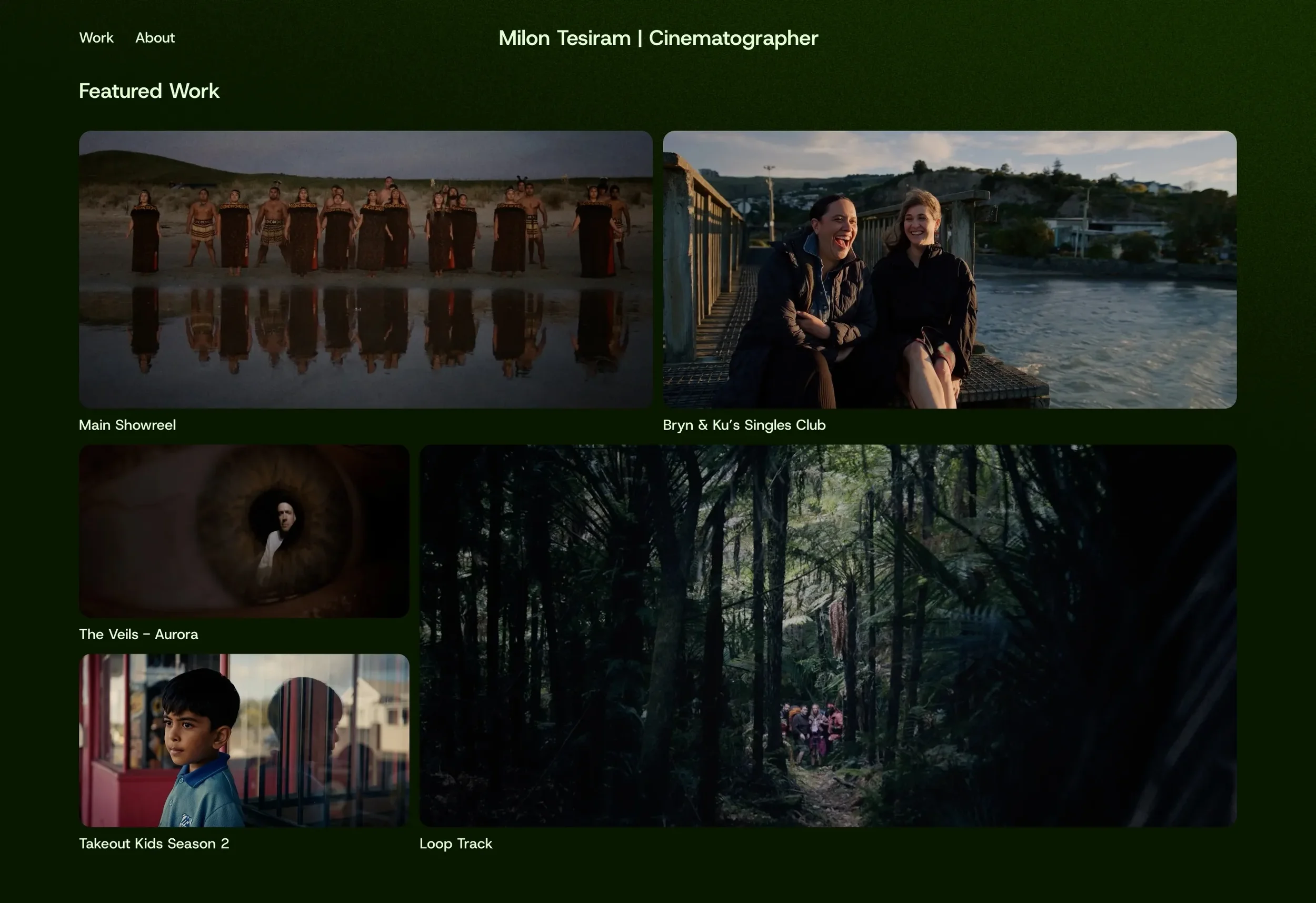 HHomepage with a Featured Work grid of film stills on a dark green background
