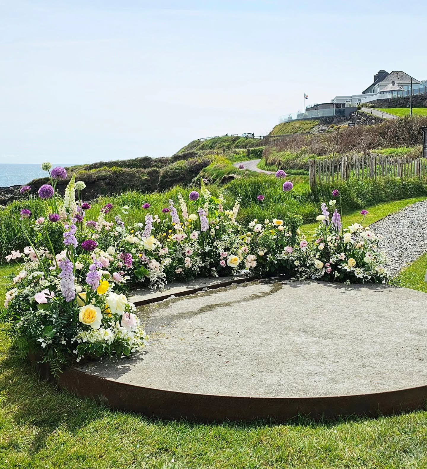 Yesterday, we created a beautiful meadow garden on the clifftop plinth at Dunmore House Hotel for Rois&iacute;n and Aidan to exchange their vows in.

The actual name of this piece is a "Ground Arch" or "Grounded Arch," but we thin