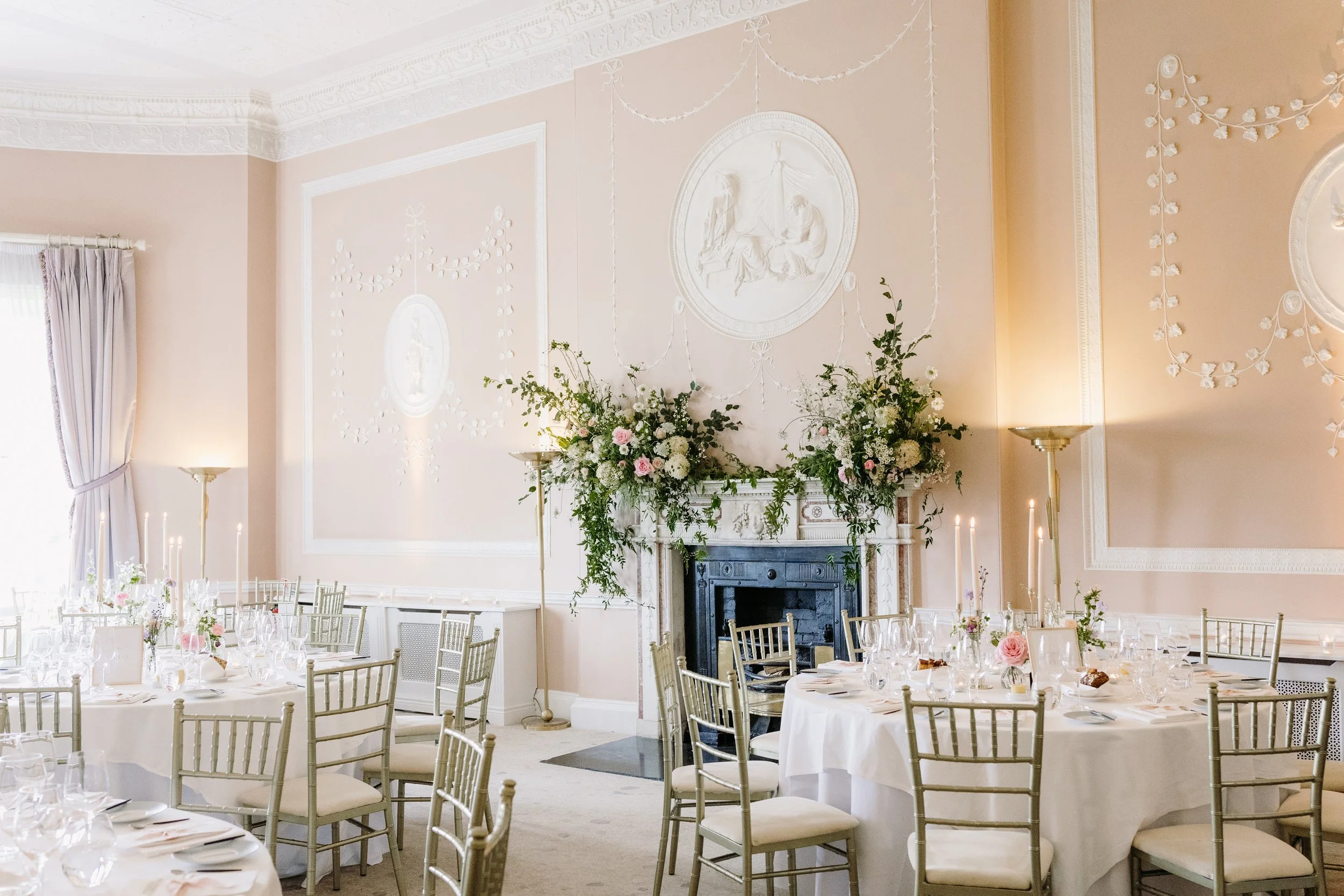 Mantlepiece floral arrangements in the Lady Helen dining room at Mount Juliet Estate. Image by Elaine Barker Photography