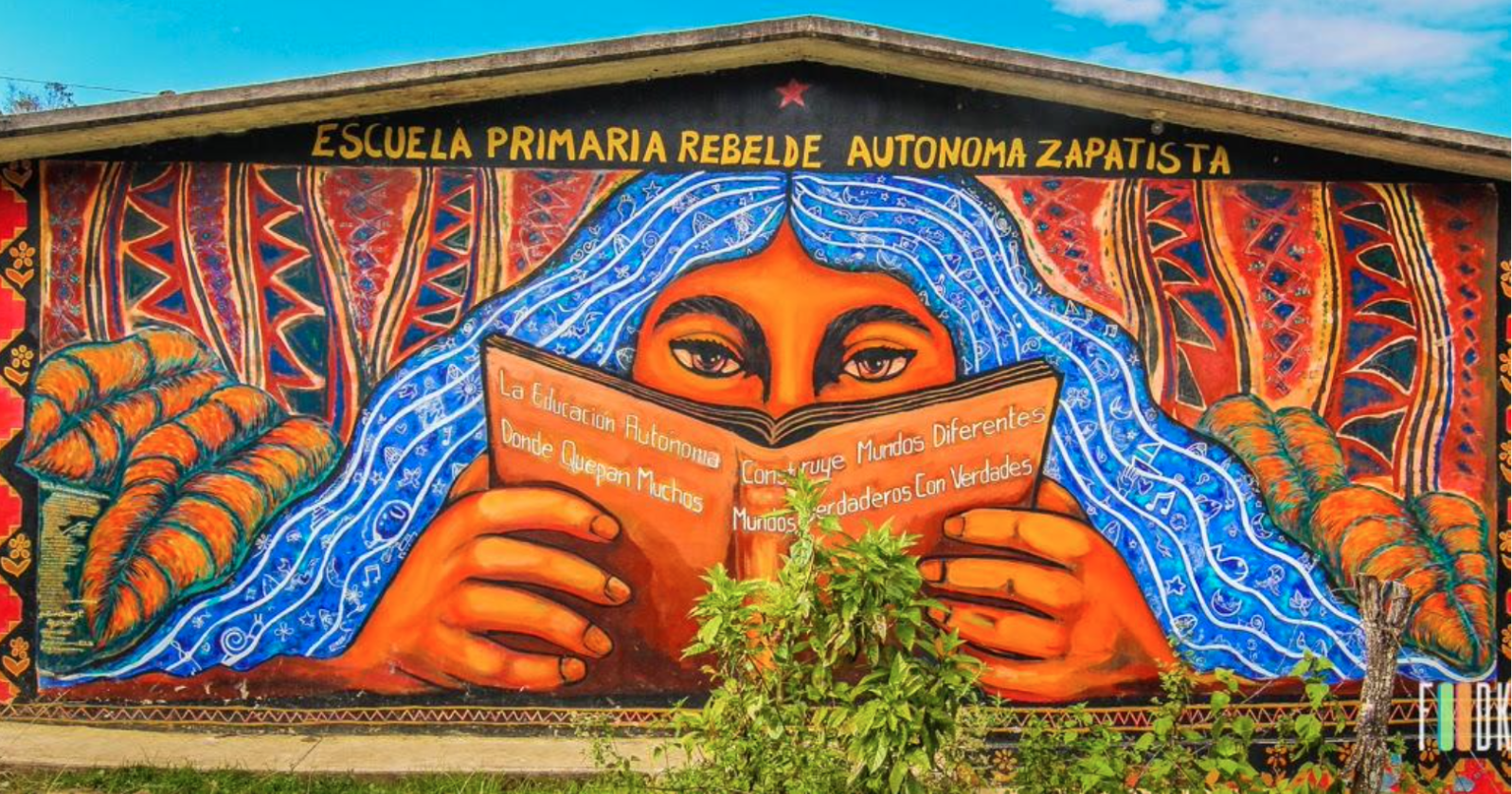 Mural by Gustavo Chavez Pavon in "La Escuela Primaria Rebelde Autonoma Zapatista de Oventik" Trans: "The Autonomous Rebel Primary School Zapatista of Oventik" Source: "Museo a Cielo Abierto en La Pincoya."
