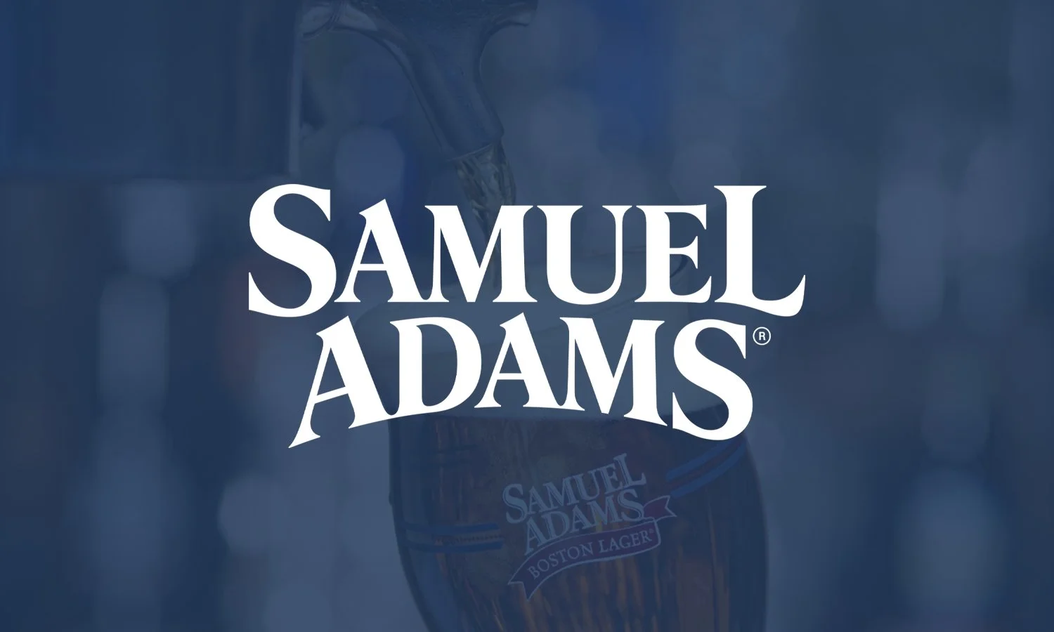 Logo for Samuel Adams with a background of a Samuel Adams Boston Lager beer glass.