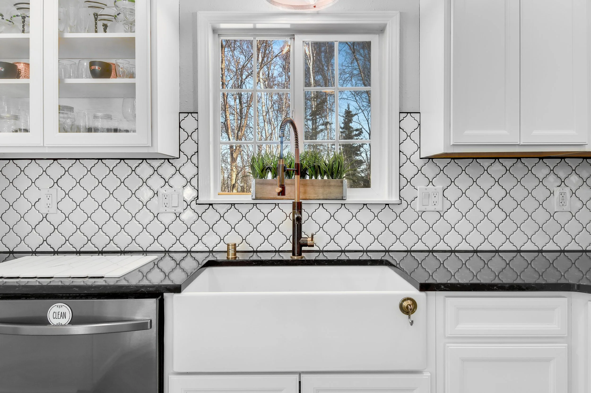 3D floor plan of a house showing rooms labeled as bedrooms, bathrooms, and a kitchen living area with hardwood floors and furniture.