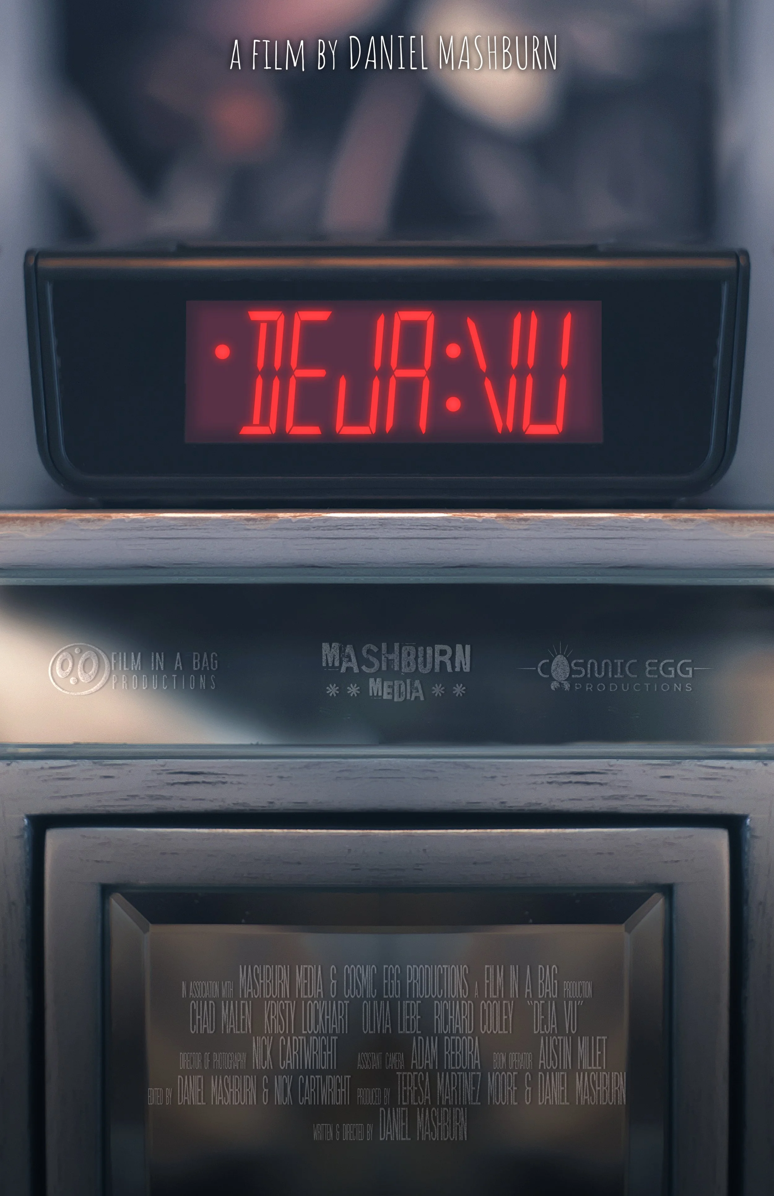Deja Vu poster - a red-light-digital alarm clock displays "DEJA:VU"
